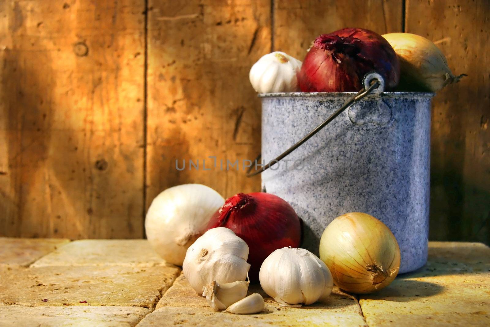 Assortment of different types onions in an old pot