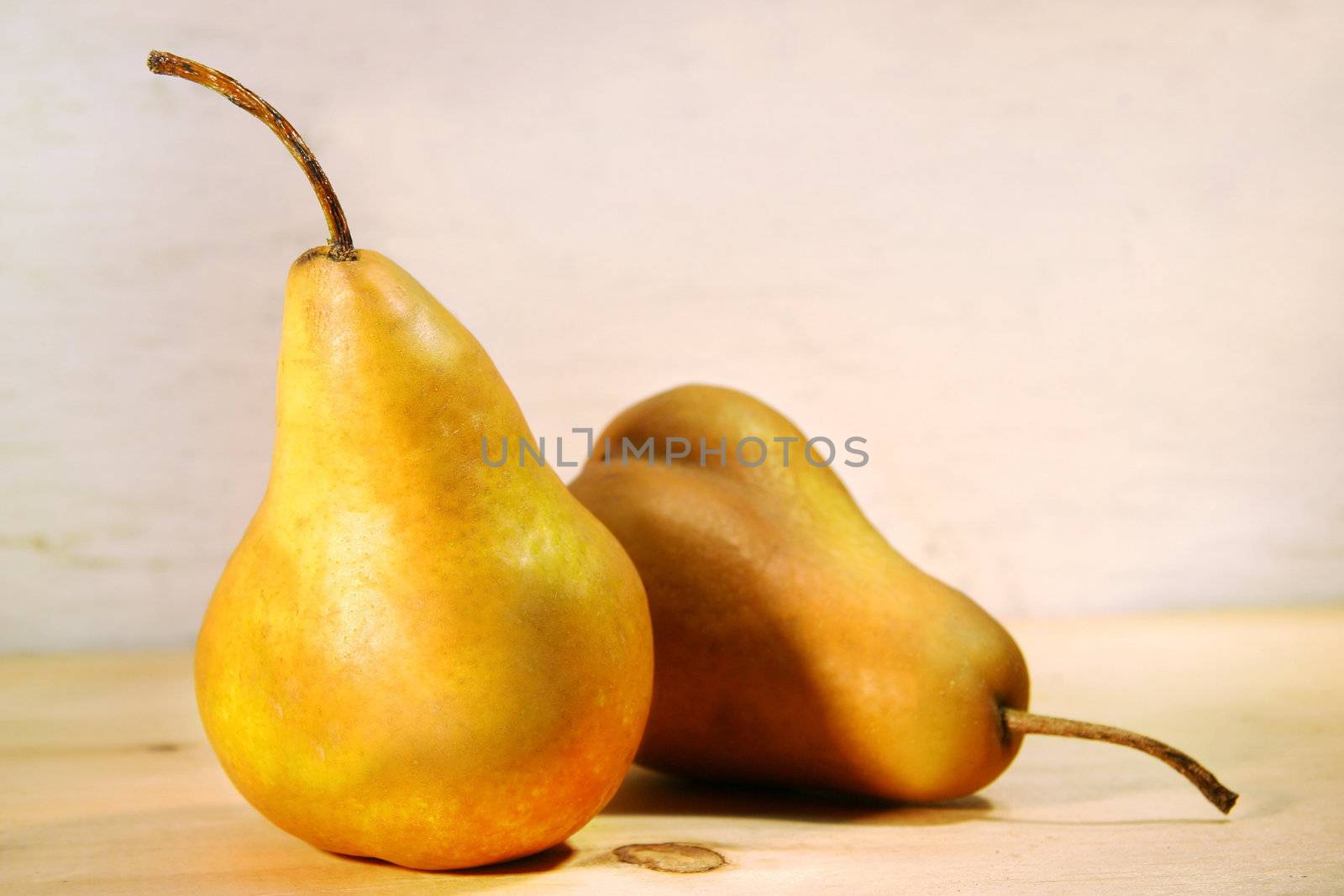Two pears on a old pine table