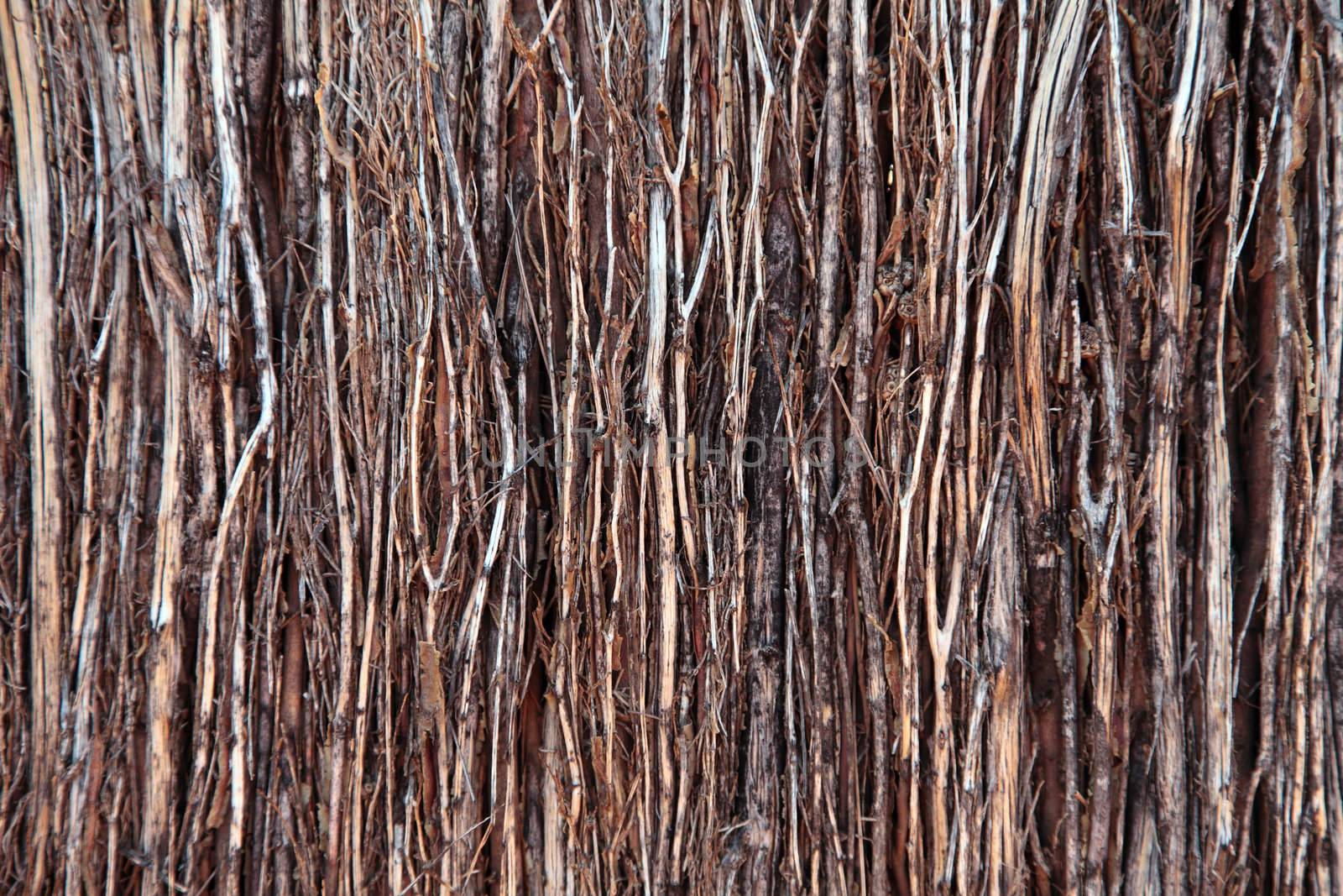 Wooden fence out ouf twigs background texture.