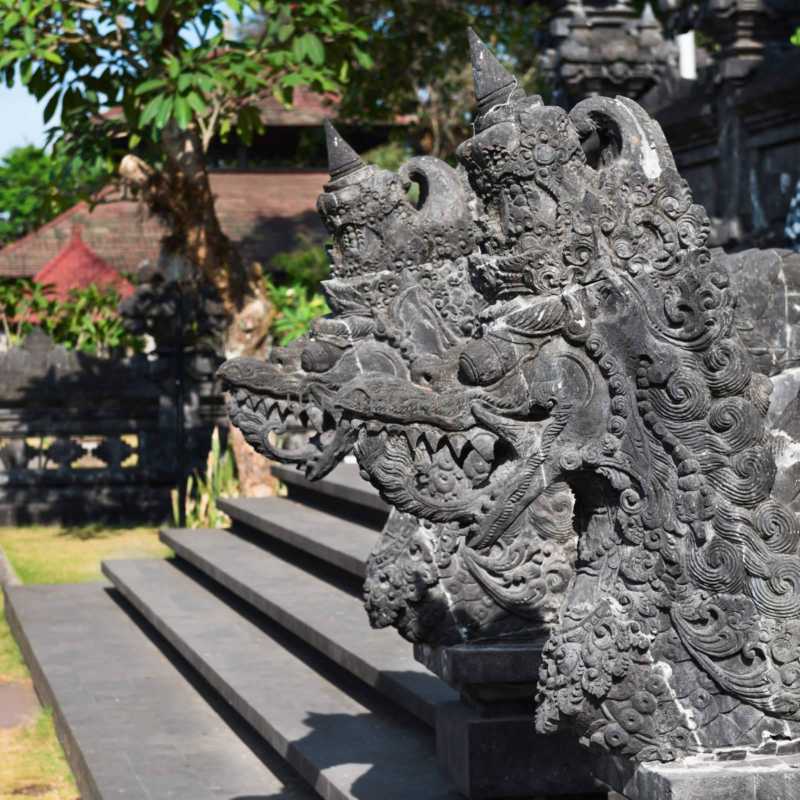 Traditional Balinese stone dragon image in Goa Lawah Bat Cave temple, Bali, Indonesia