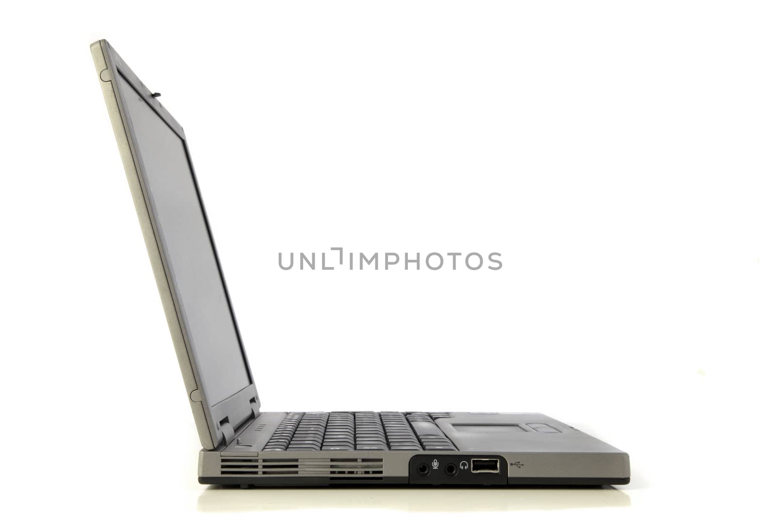 Side view of a standard notebook computer. All isolated on white background.