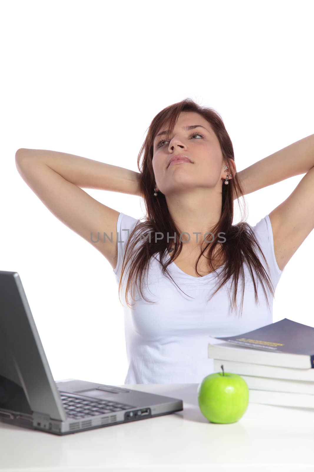 An attractive student taking a break. All on white background. 