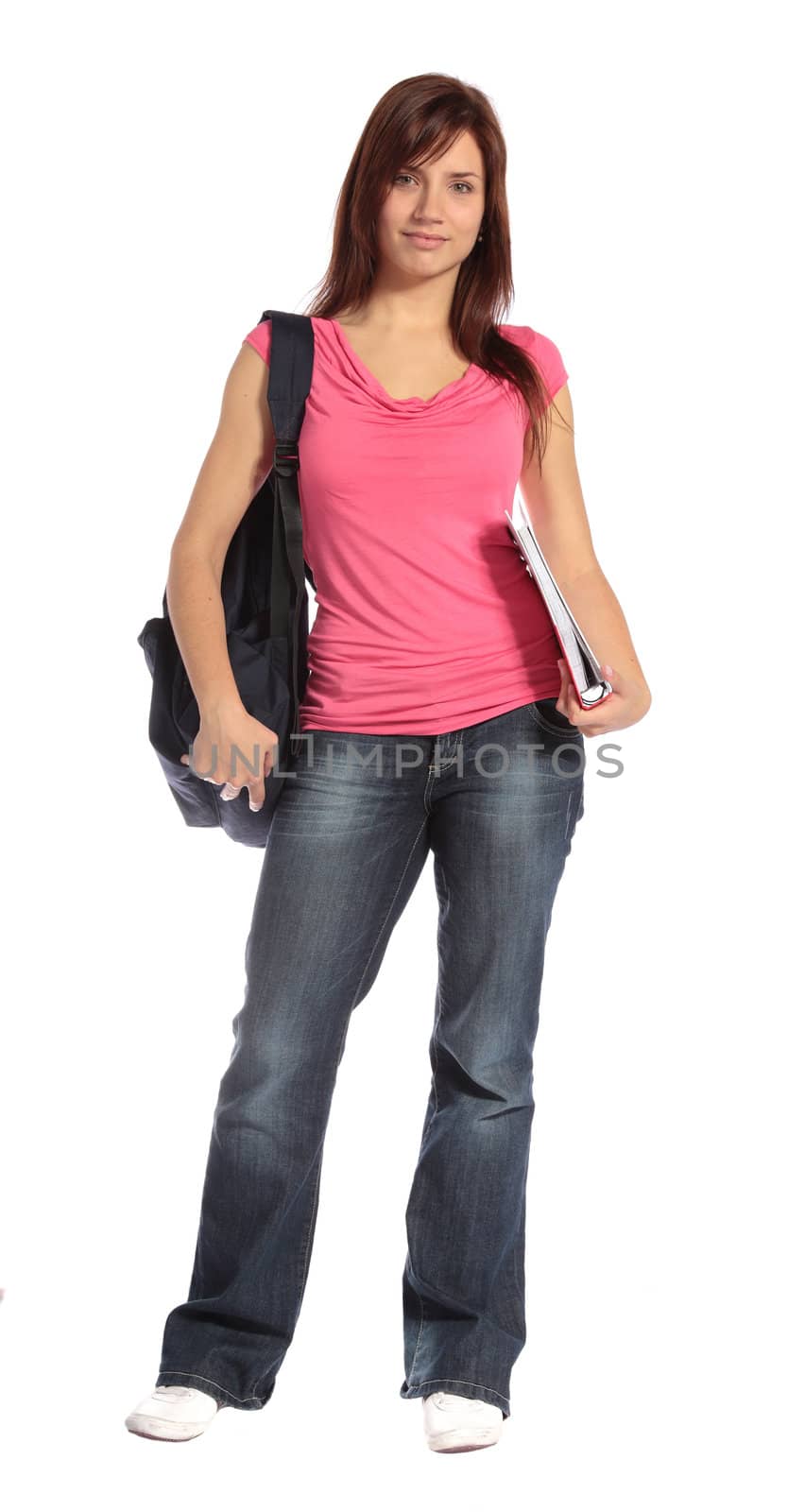 An attractive student standing in front of a plain white background. 