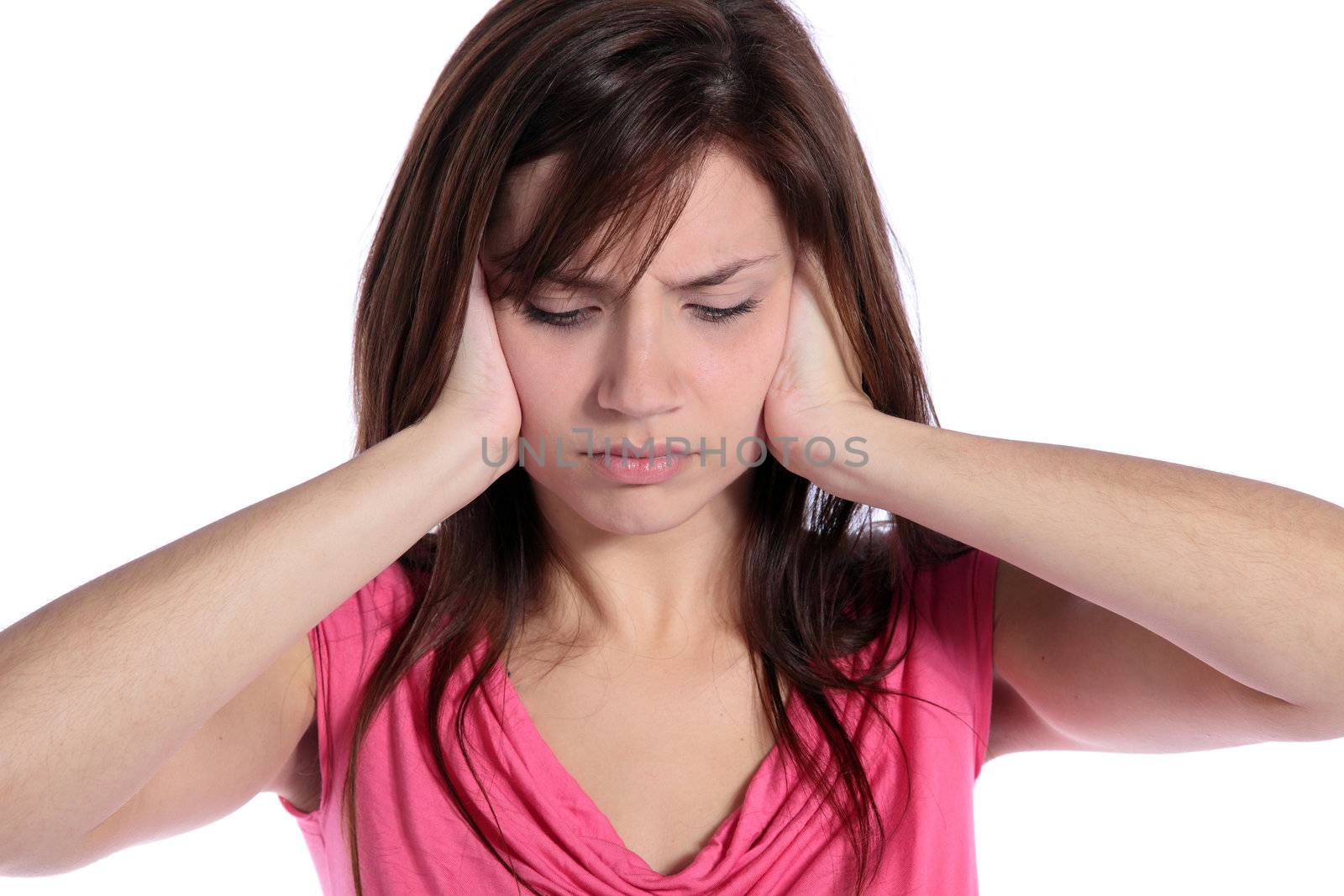 An attractive young woman suffering from tinnitus. All on white background. 