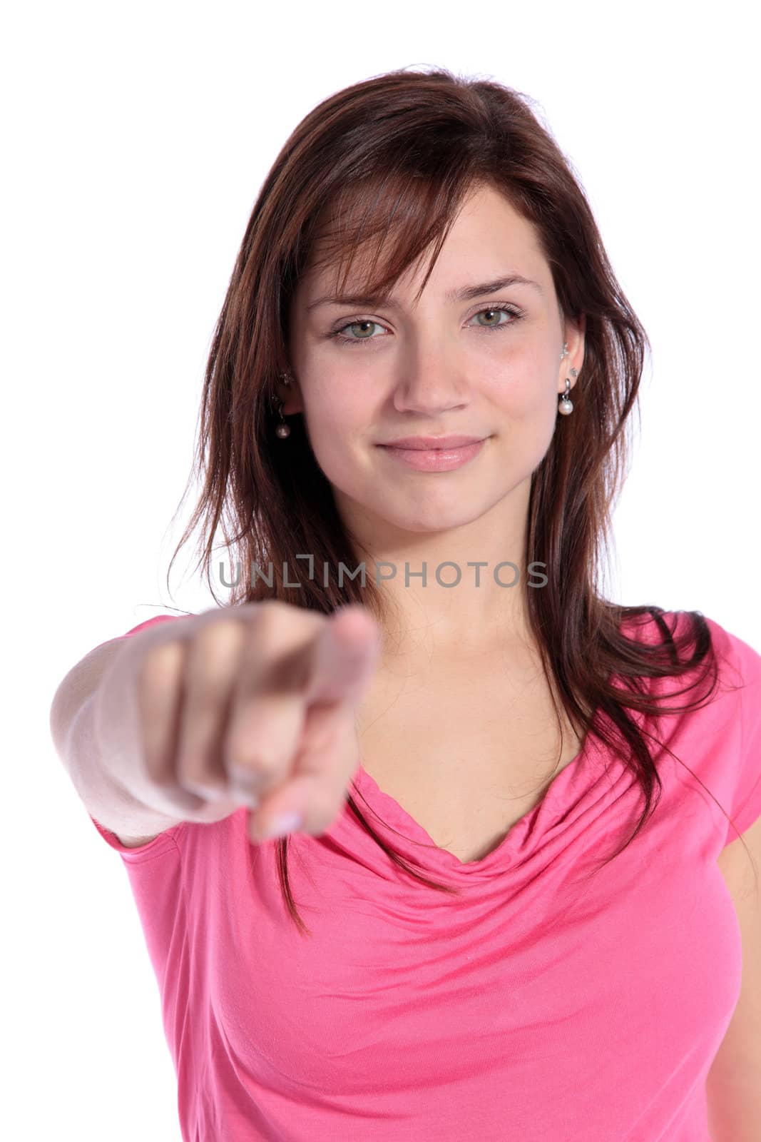 An attractive young woman pointing with finger. All on white background. 