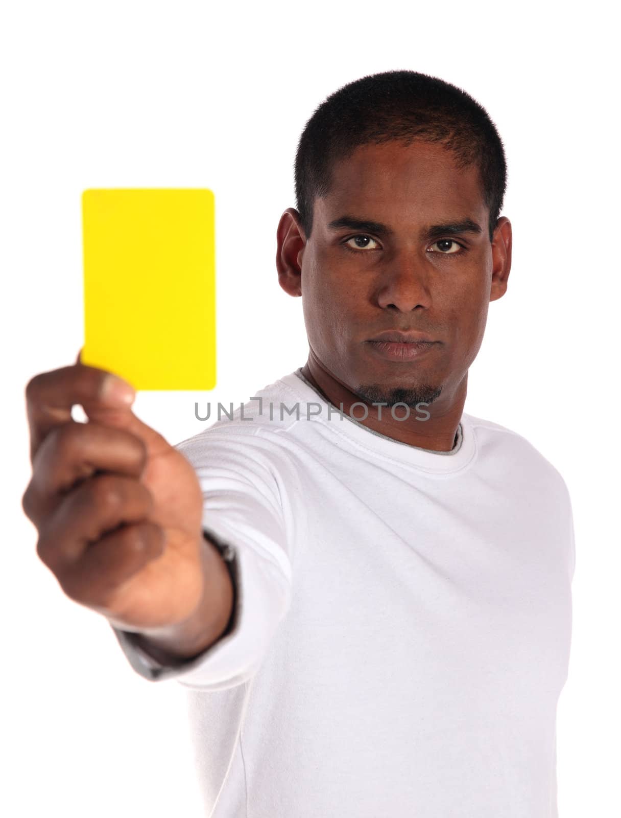 An attractive dark-skinned man showing a yellow card. All on white background. 