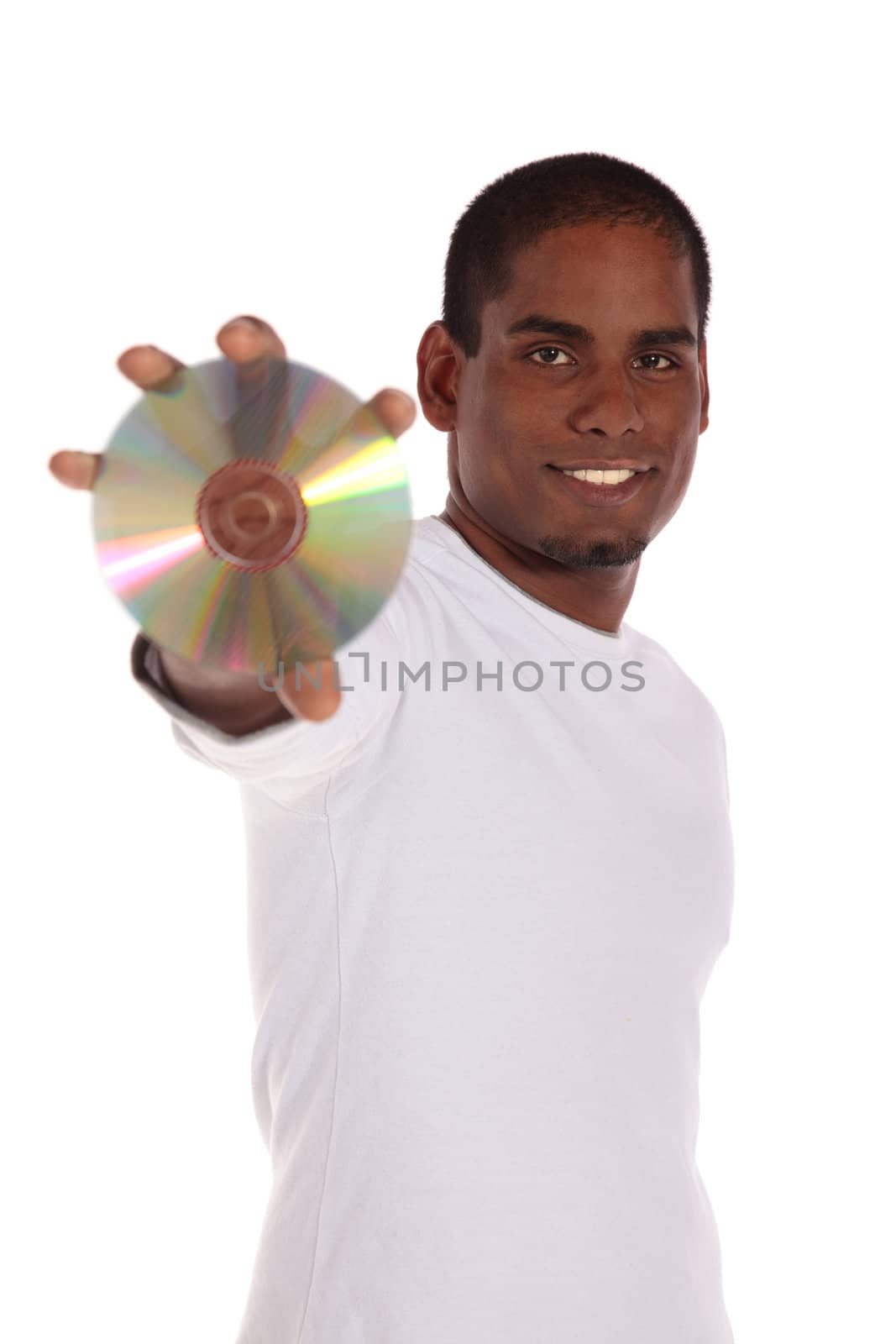 An attractive dark-skinned man holding a cd or dvd. All on white background.