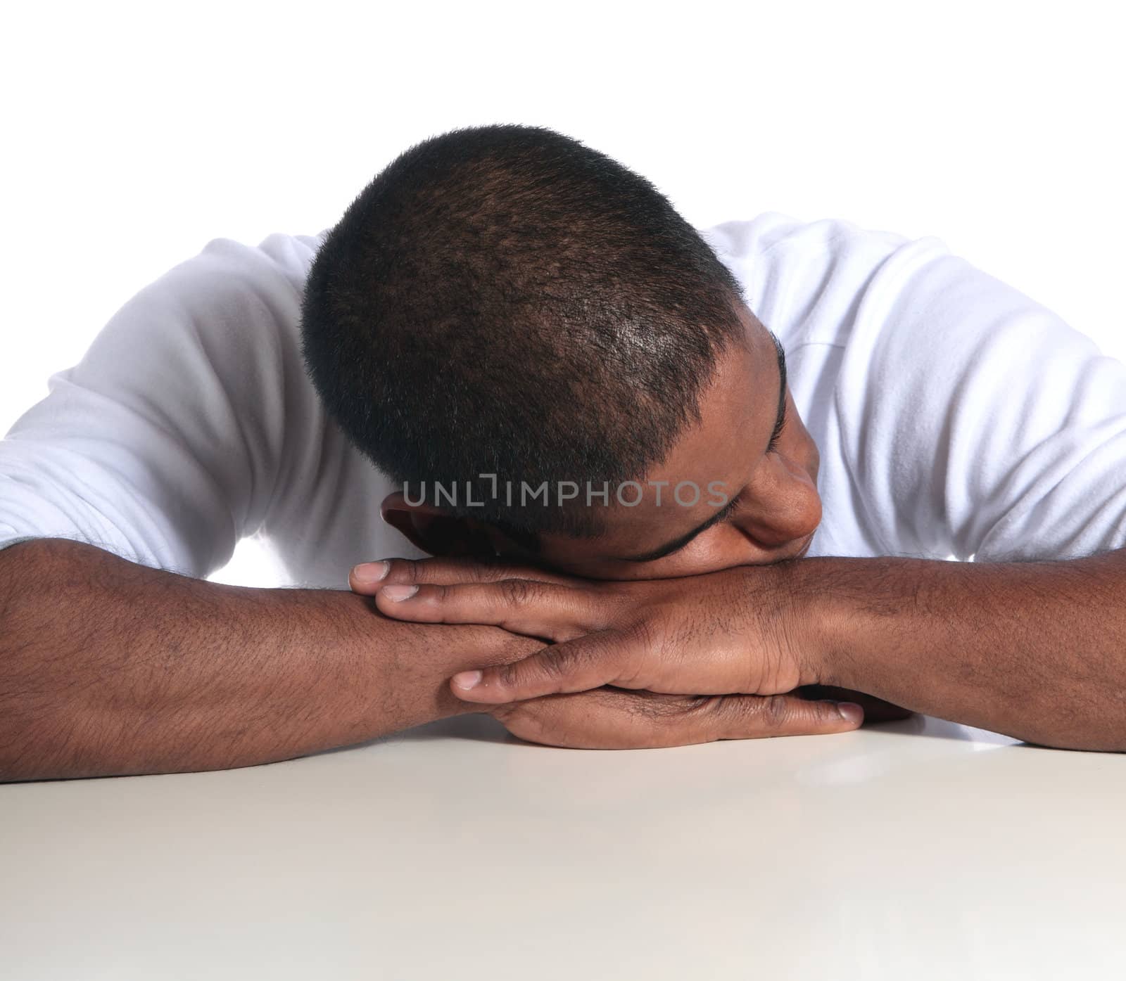 An attractive dark-skinned man sleeping. All on white background.