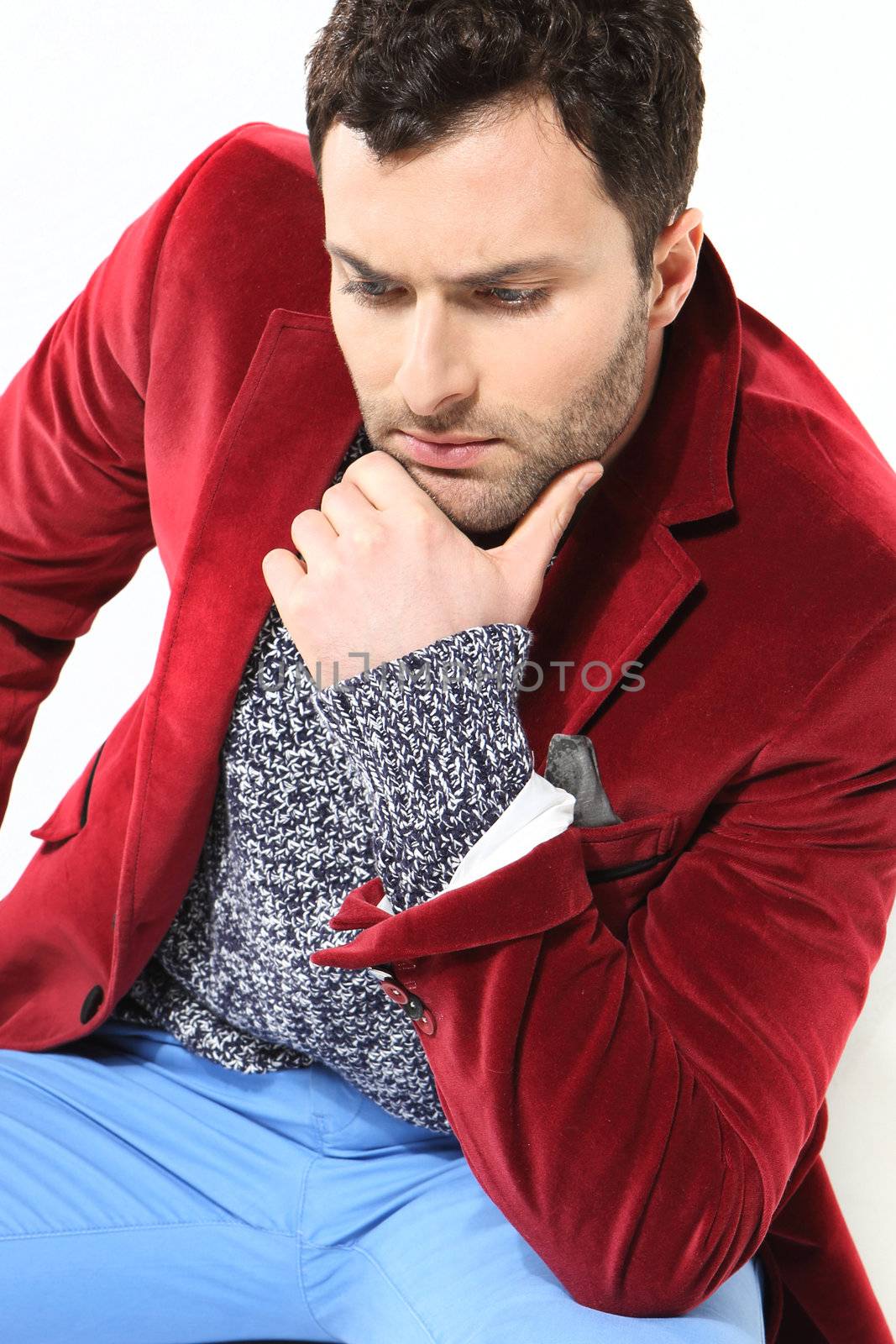 Handsome man posing in a red jacket