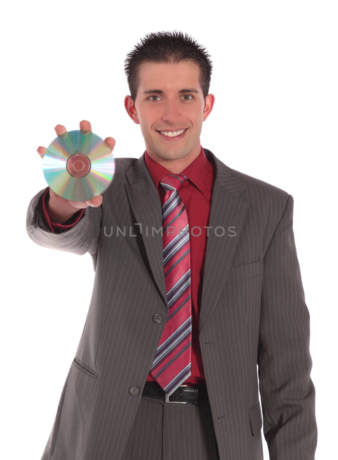 A handsome businessman holding CD or DVD. All on white background.
