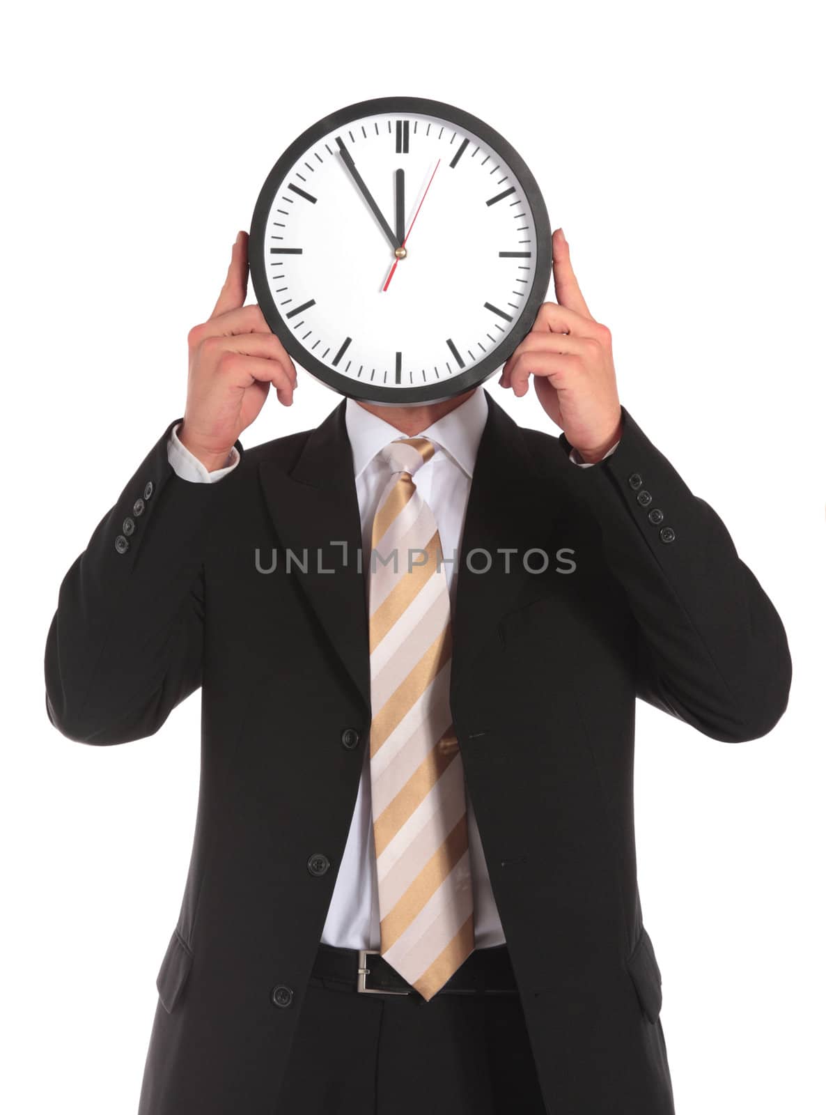 A businessman holding a clock that shows the eleventh hour right in front of his face. All on white background.