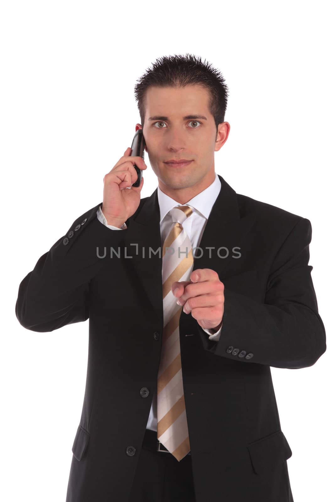 A businessman making a serious phone call and pointing with finger. All on white background.