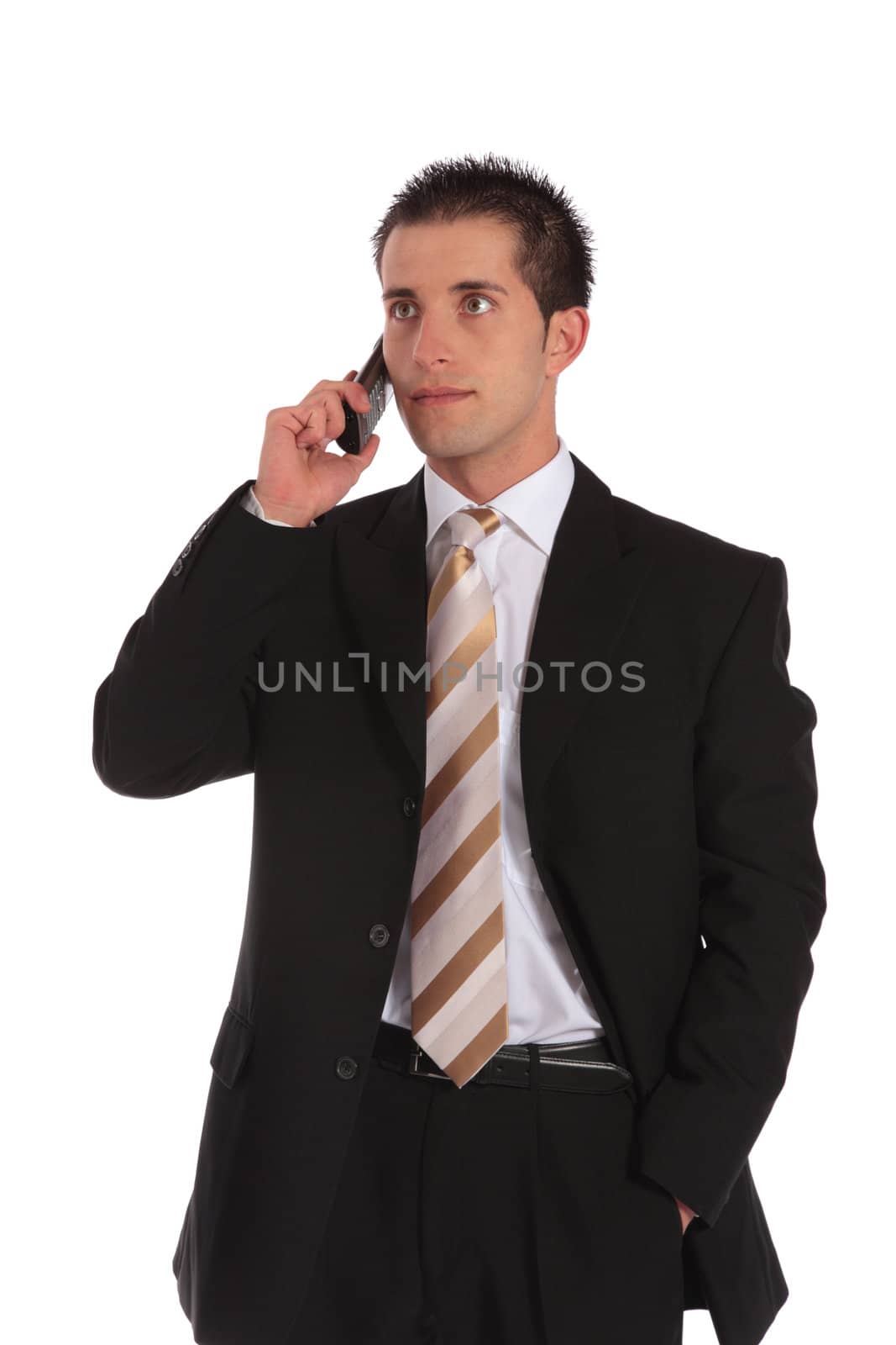 A handsome businessman getting a phone call. All on white background.