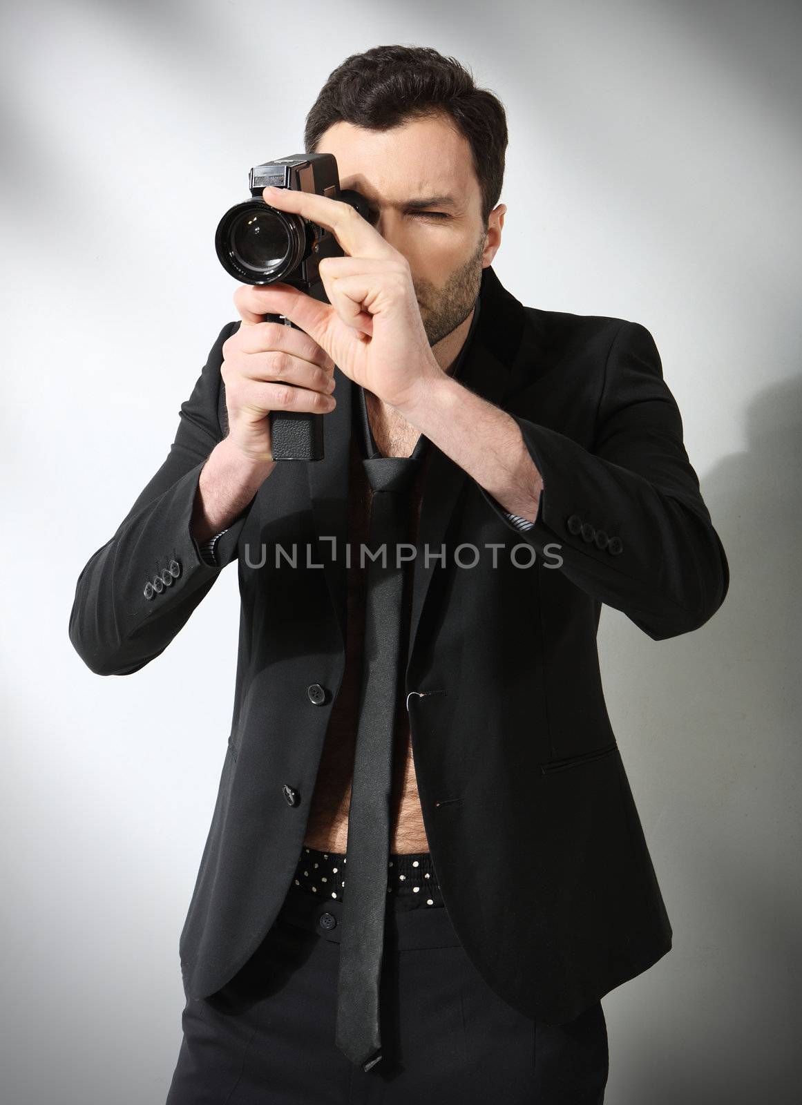 Attractive man taking photo