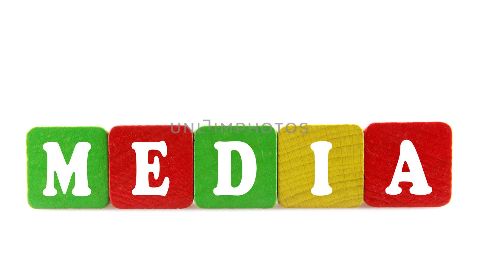 media - isolated text in wooden building blocks