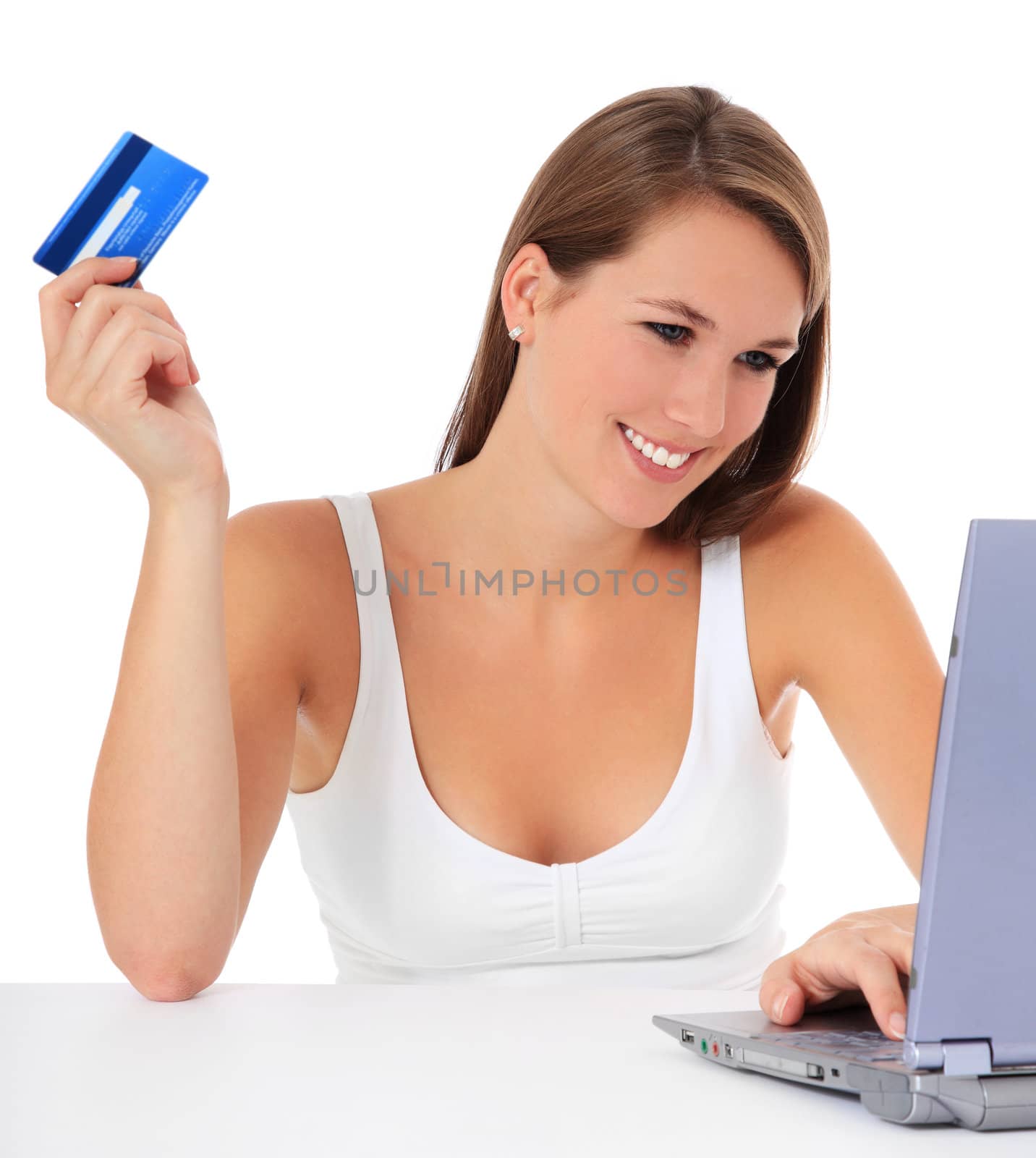 Attractive young woman using her credit card to buy things on the internet. All on white background.