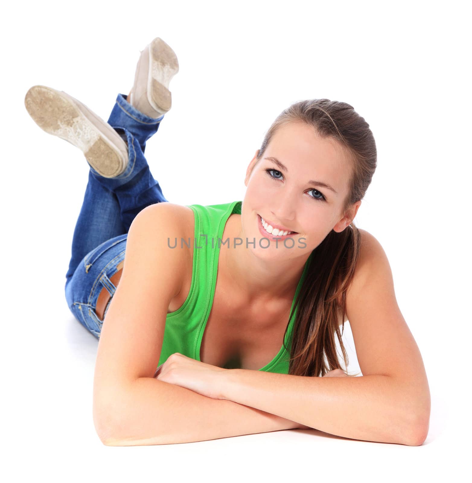 Attractive young woman lying on the ground. All on white background.