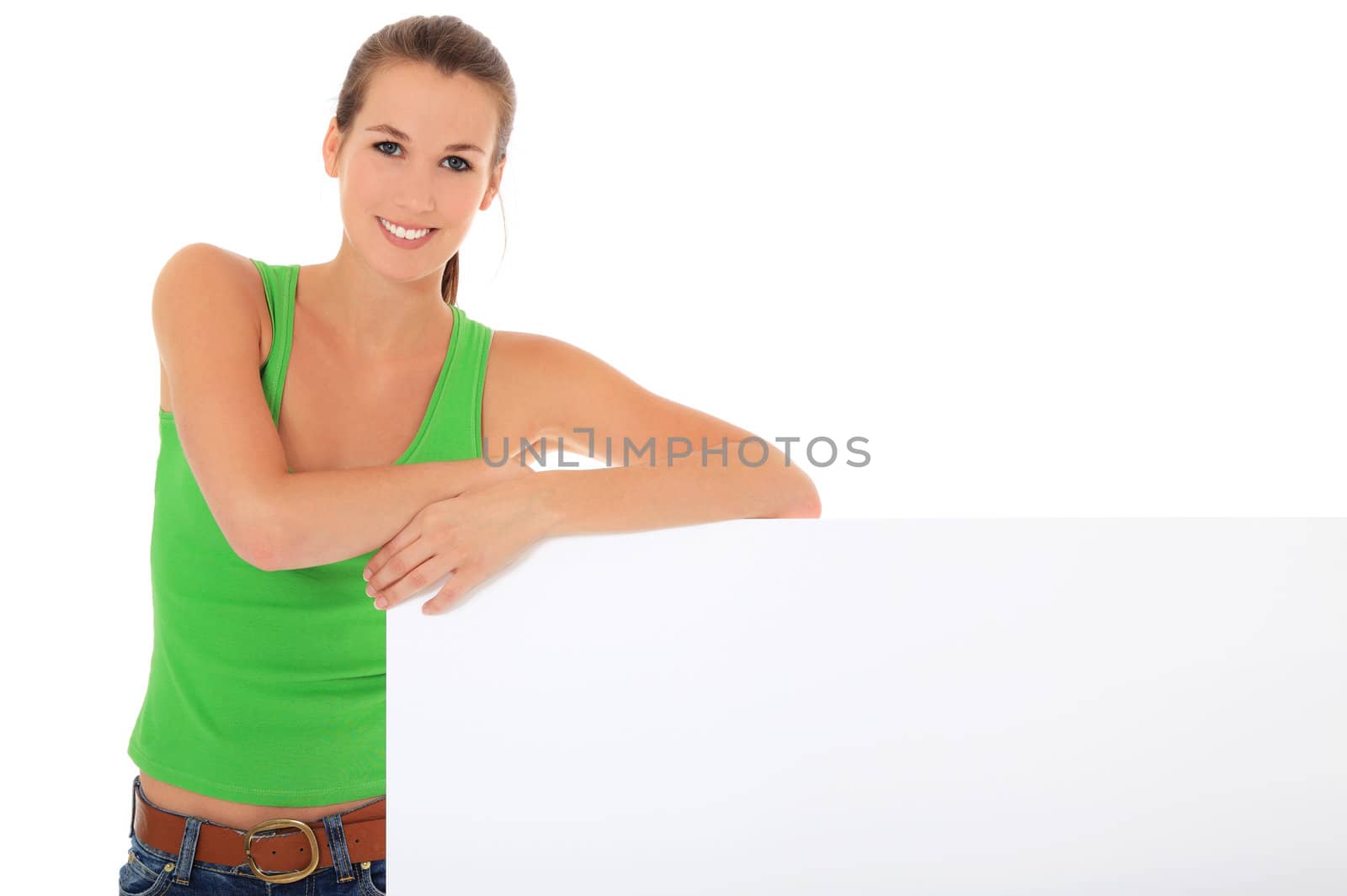 Attractive young woman standing next to blank sign. All on white background.