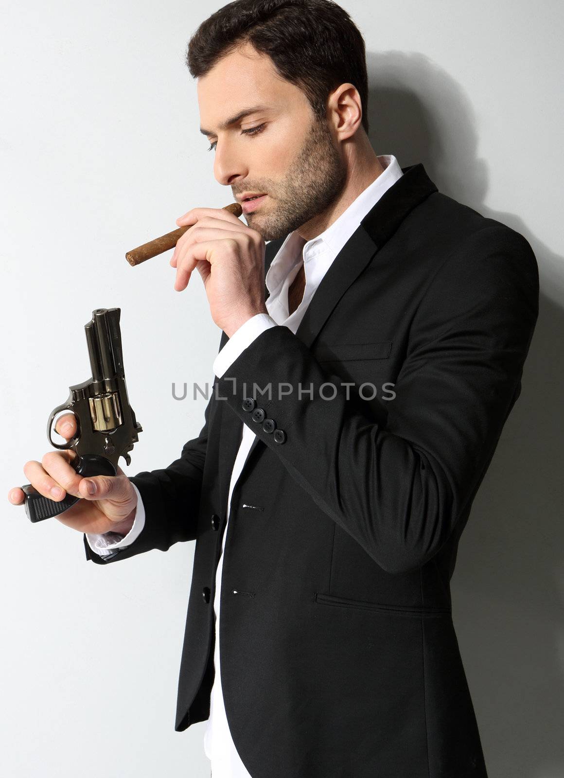 Man Holding a fire gun and smoking a cigar by robert_przybysz