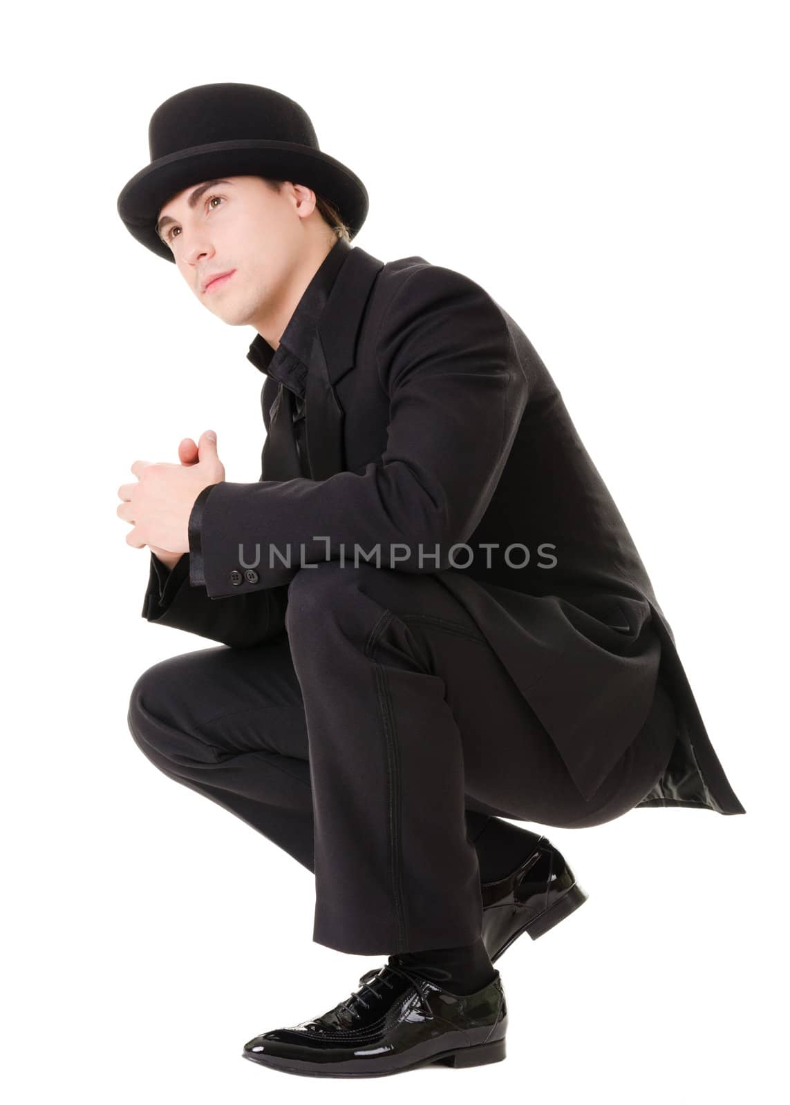 Handsome fashionable man in retro style with black suit and hat isolated on white background