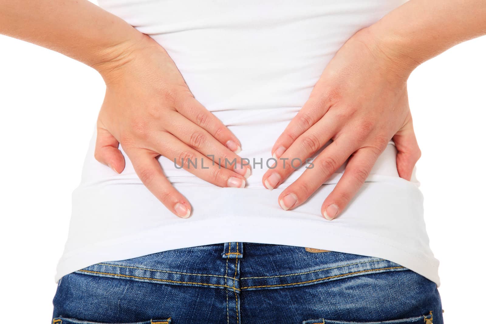 Attractive young woman suffers from back pain. All on white background.