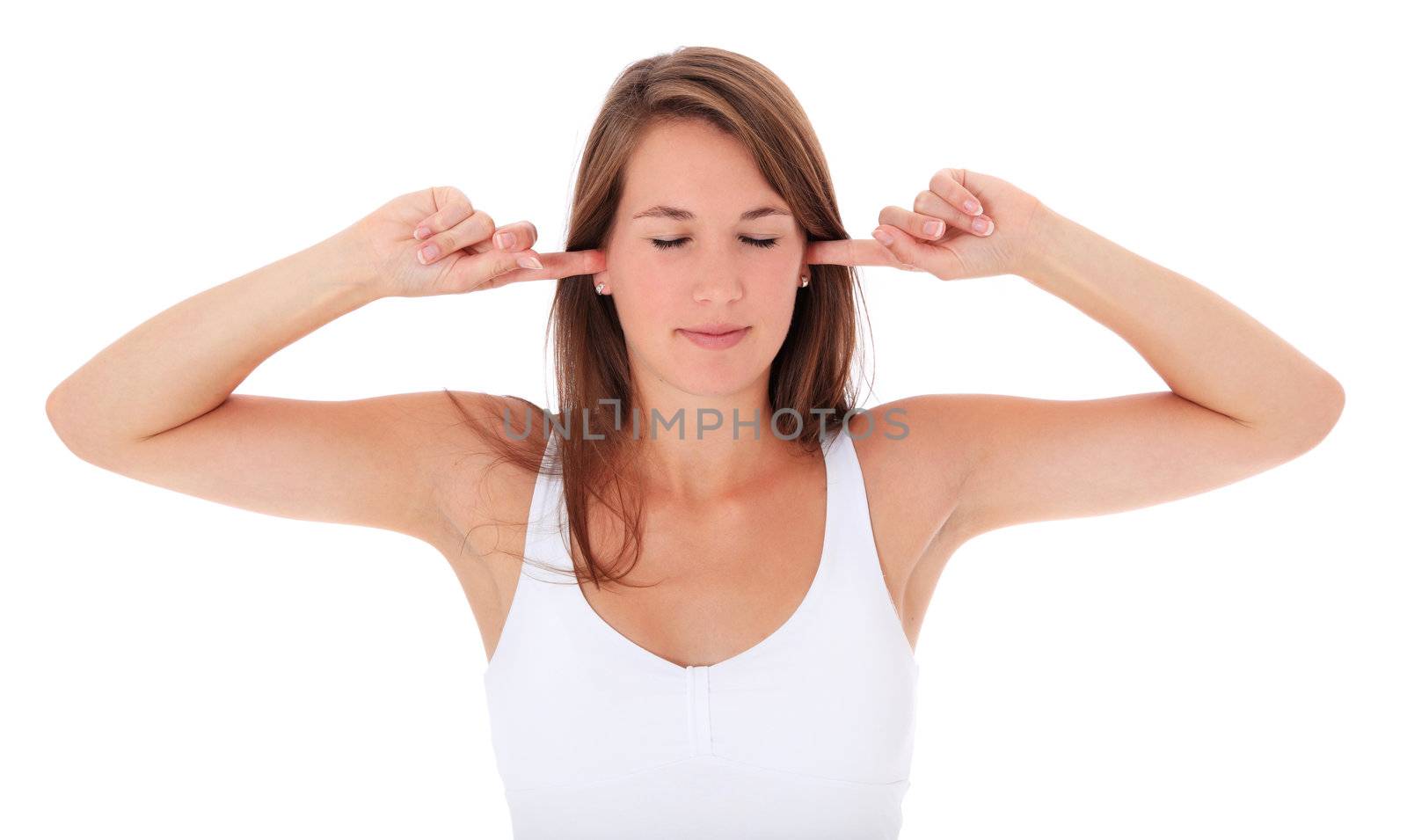 Attractive young woman keeping her ears shut. All on white background.