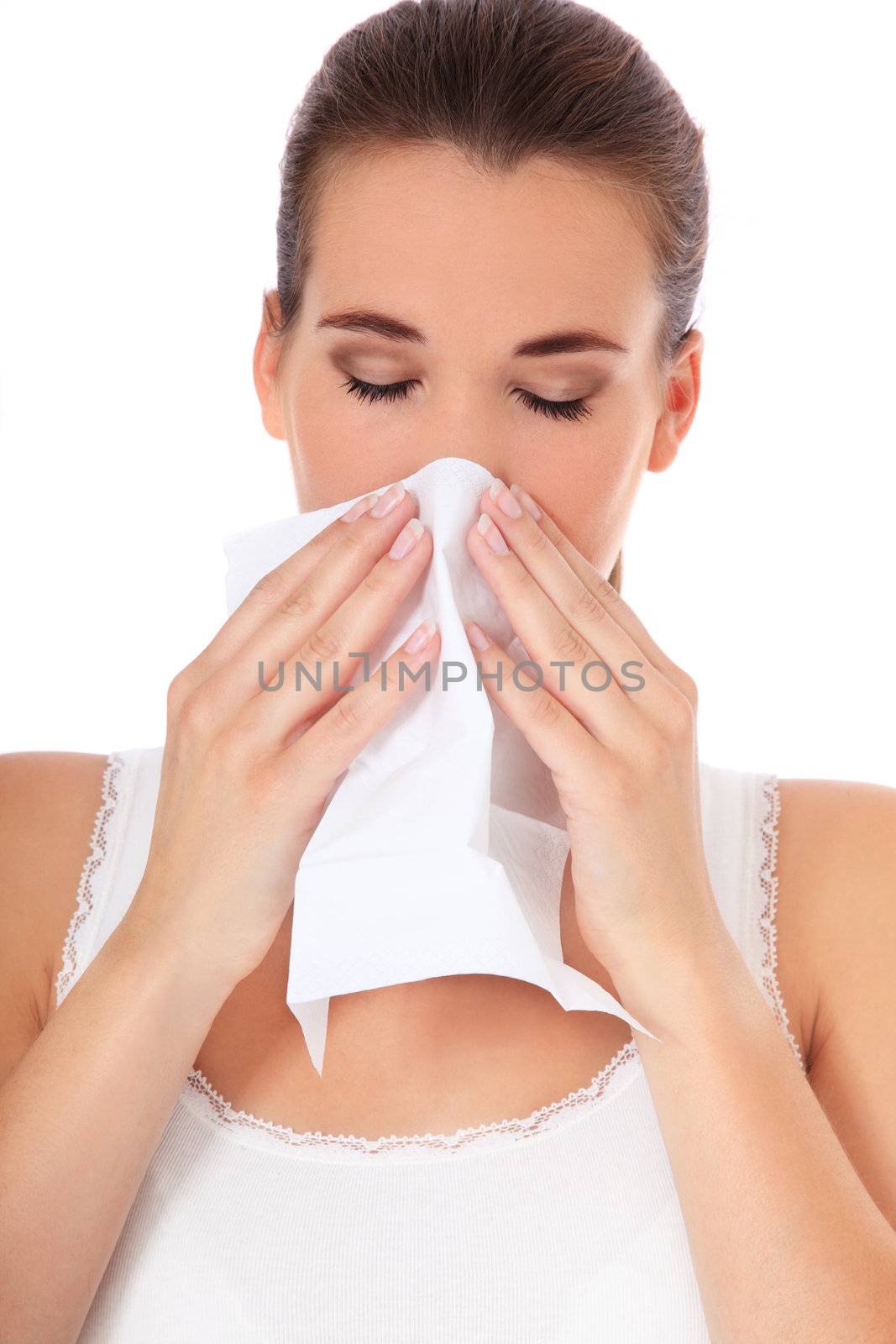 Attractive young woman suffers from hayfever. All on white background.