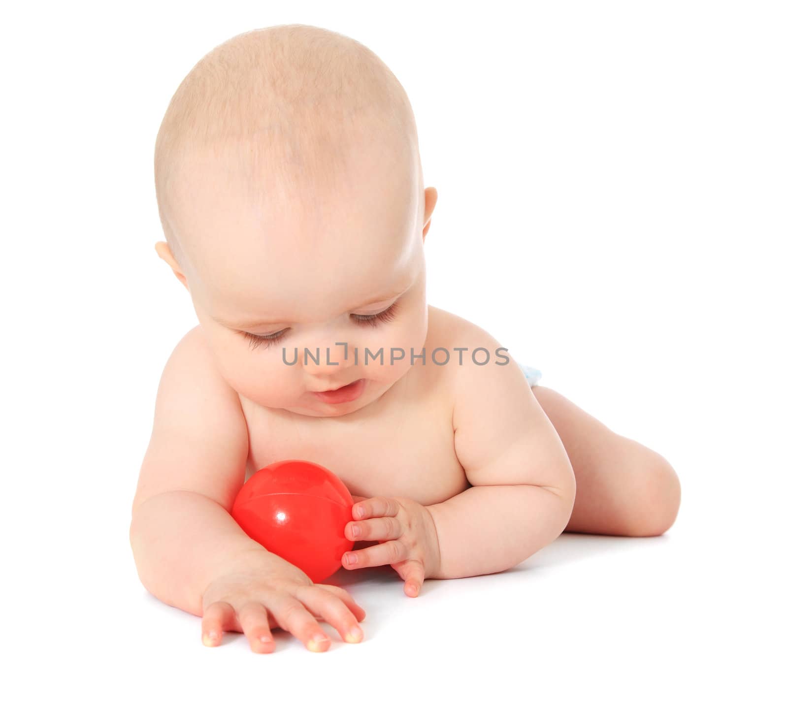 Newborn child playing with a red ball. All isolated on white background.