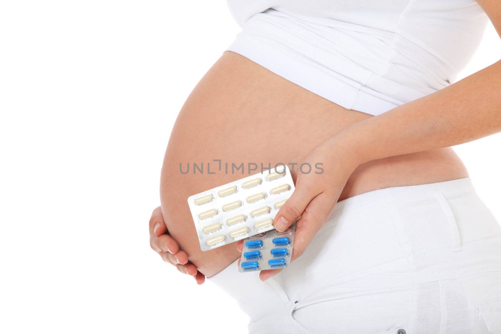 Pregnant woman holding pharmaceuticals. All on white background.