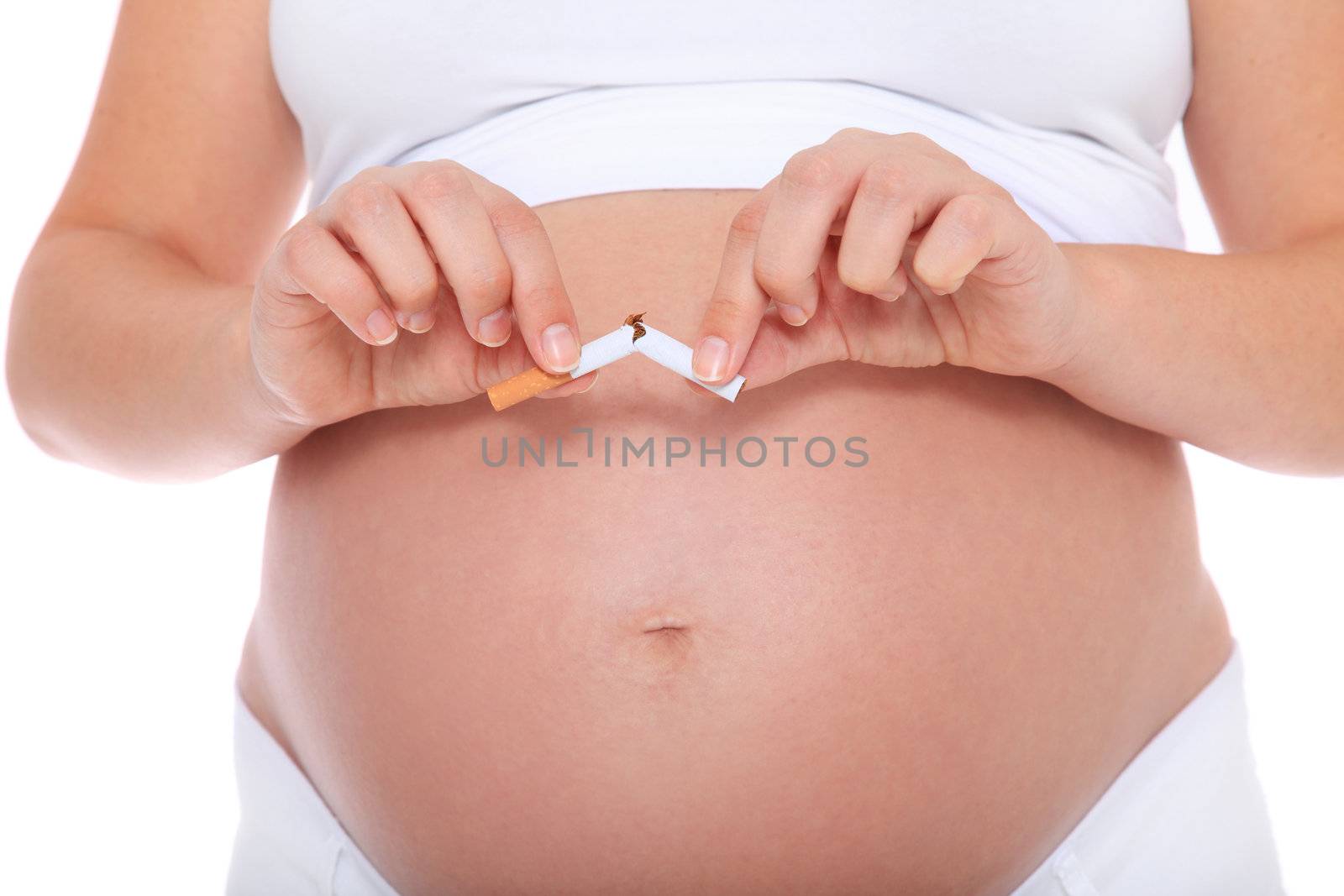 Pregnant woman quits smoking. All on white background.