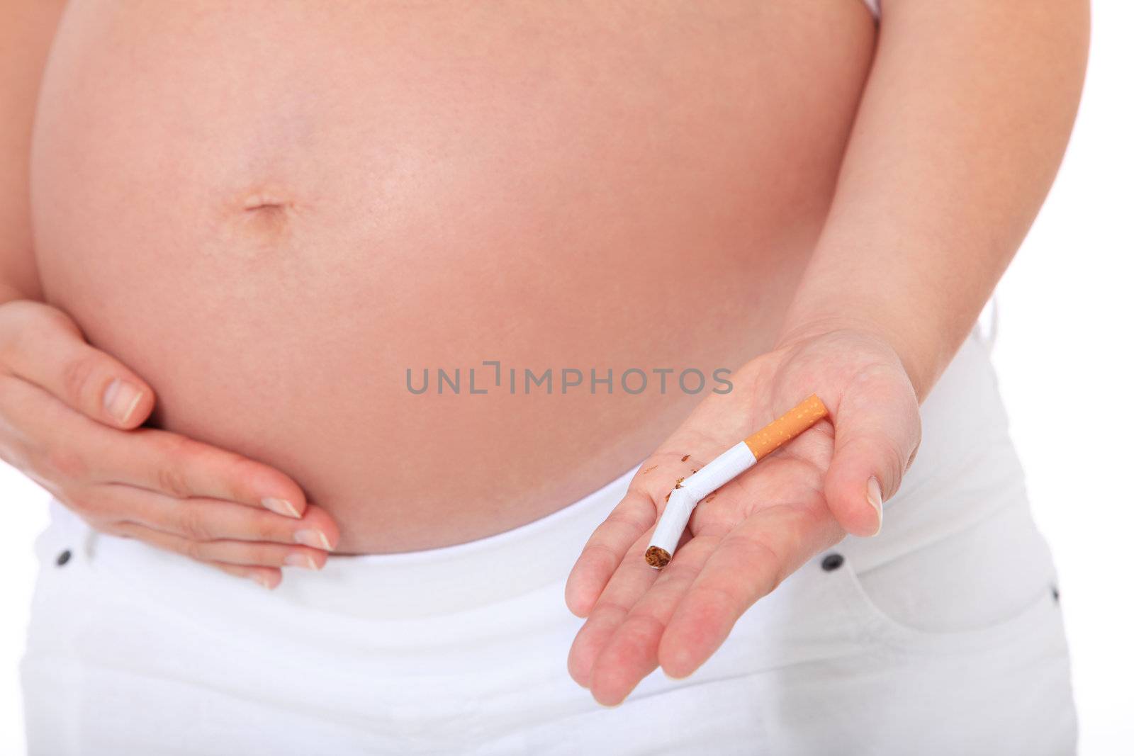 Pregnant woman quits smoking. All on white background.