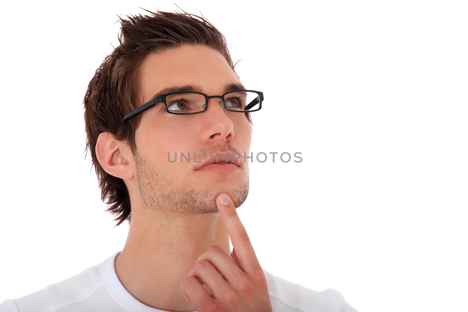 Attractive young man deliberates a decision. All on white background.