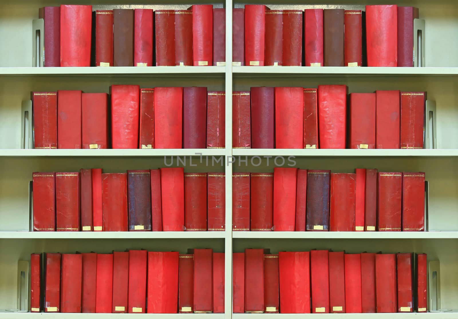 red old hardcover books on shelf