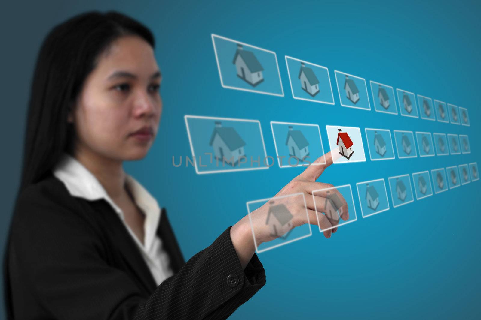 asian business woman select real estate from electronic commerce concept (Selective focus on hand)