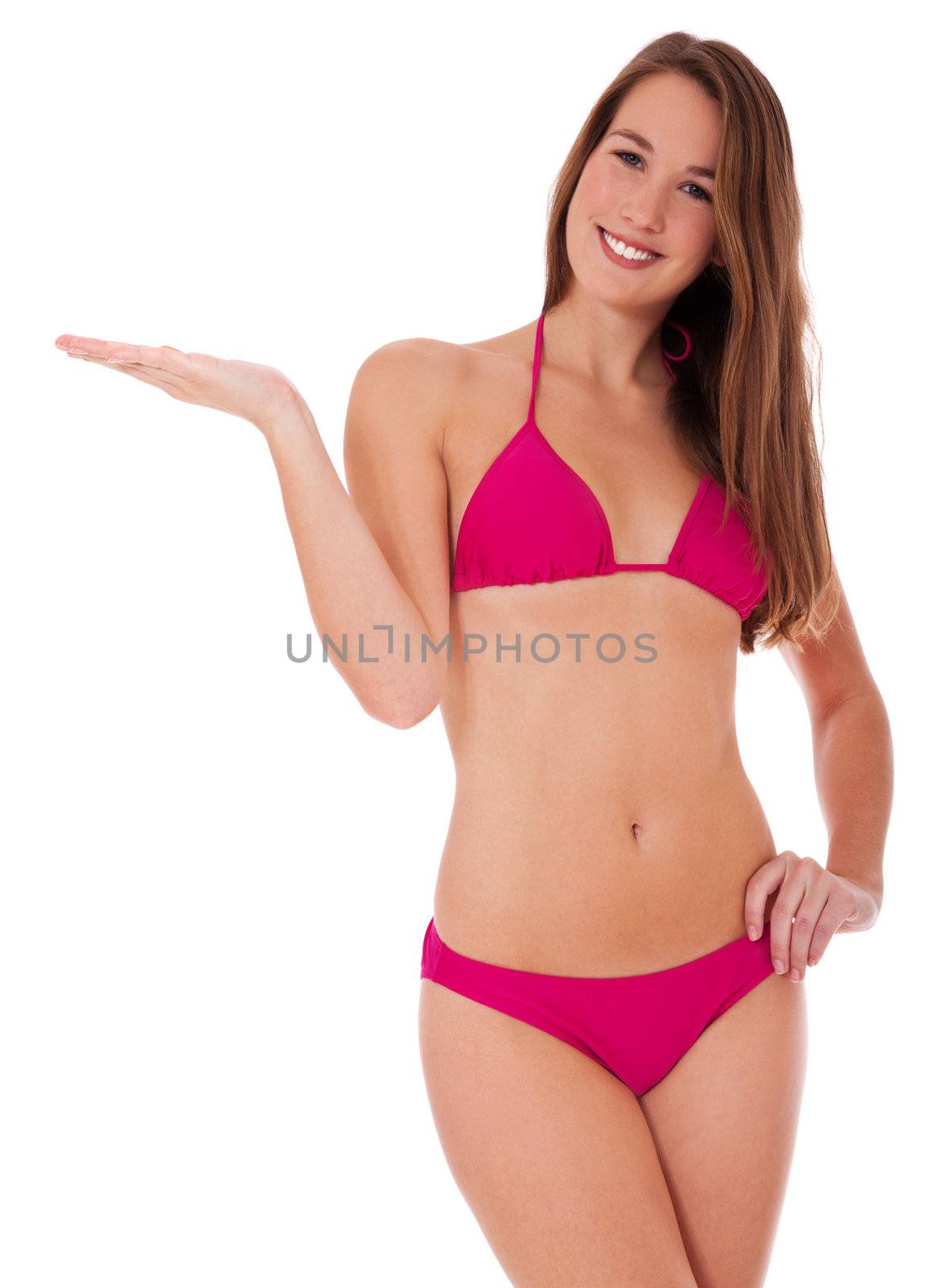 Attractive young woman pointing to the side. All on white background.