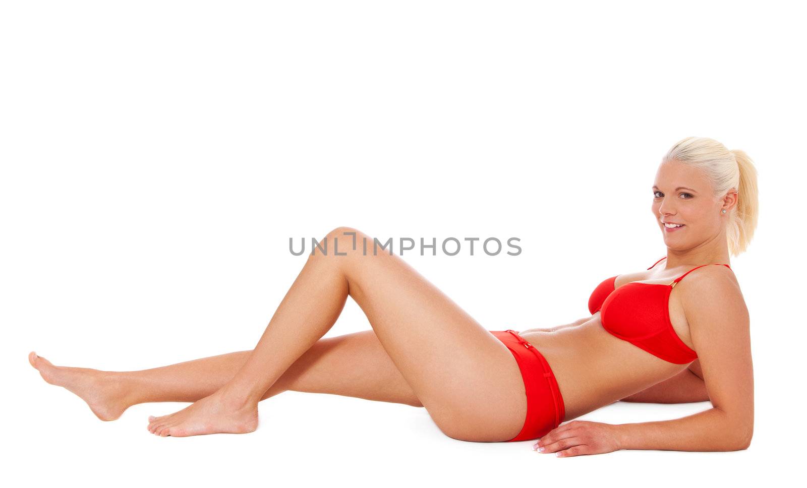 Attractive women in bikini lying on the floor. Isolated on white background.