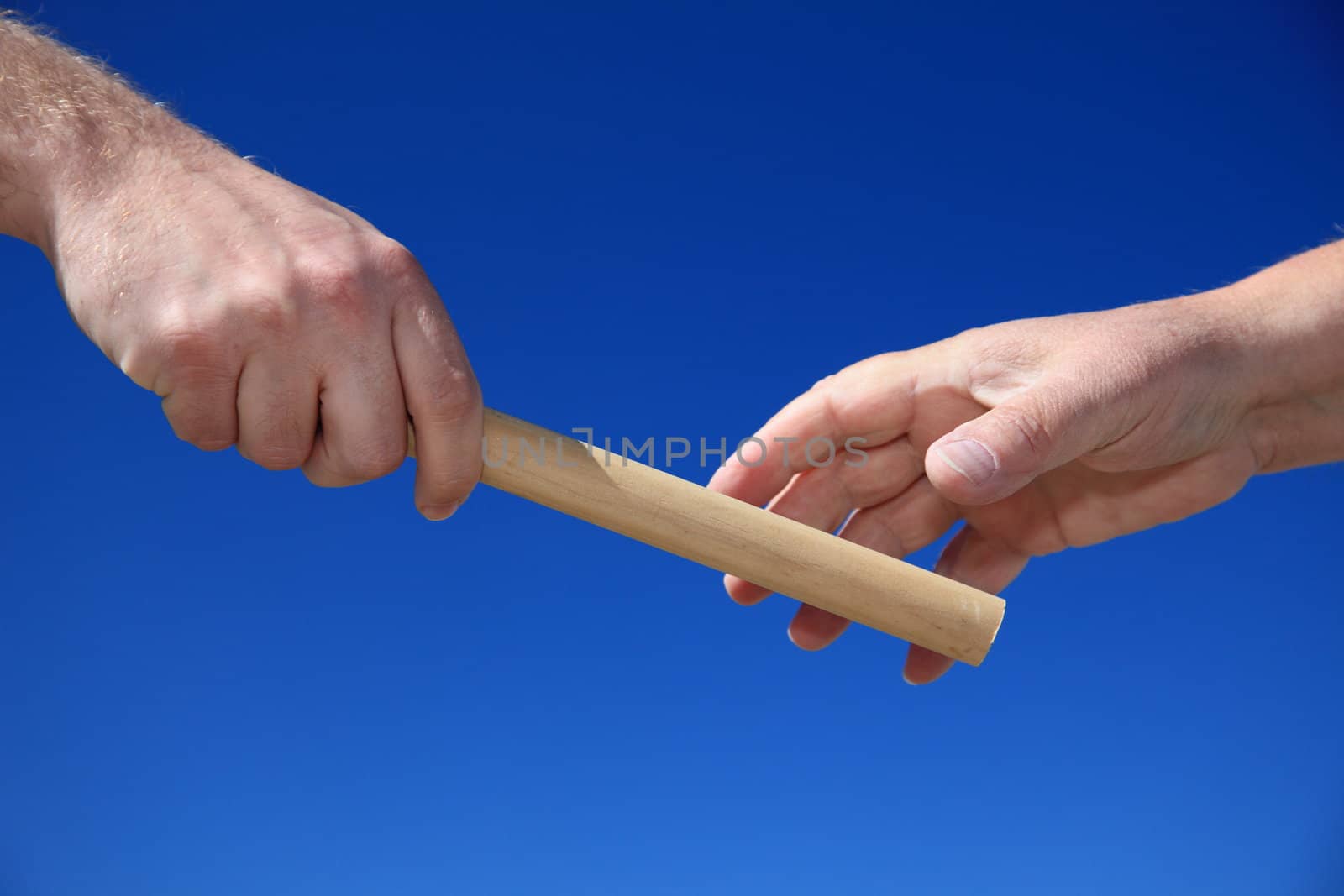 Handing someone a baton.