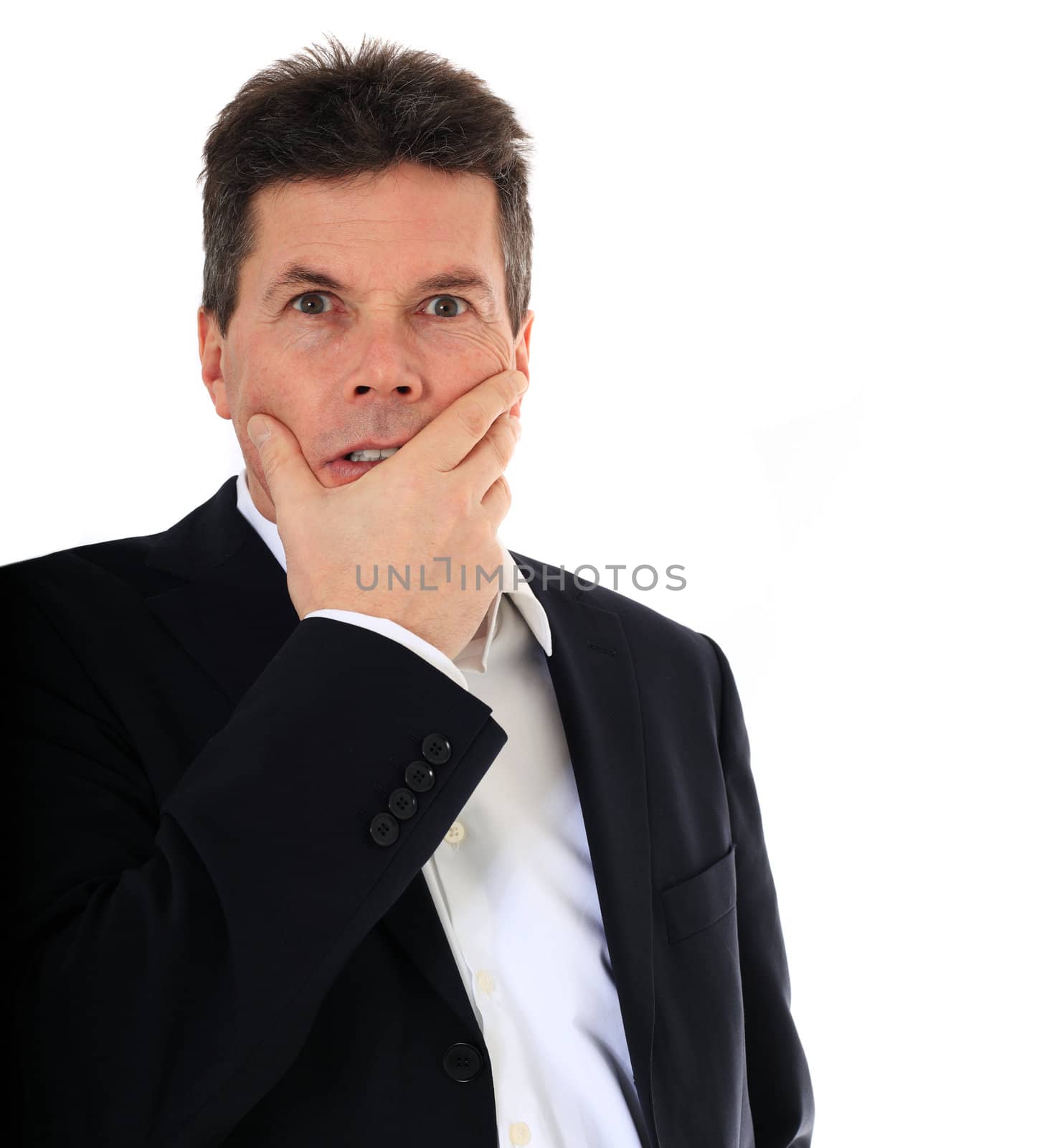 Attractive middle-aged man deliberates a decision. All on white background.