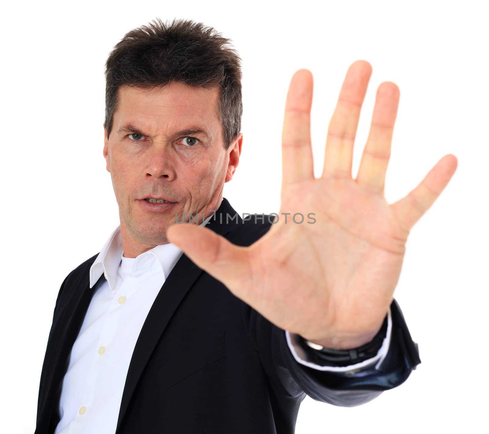 Attractive middle-aged man making repelling gesture. All on white background.