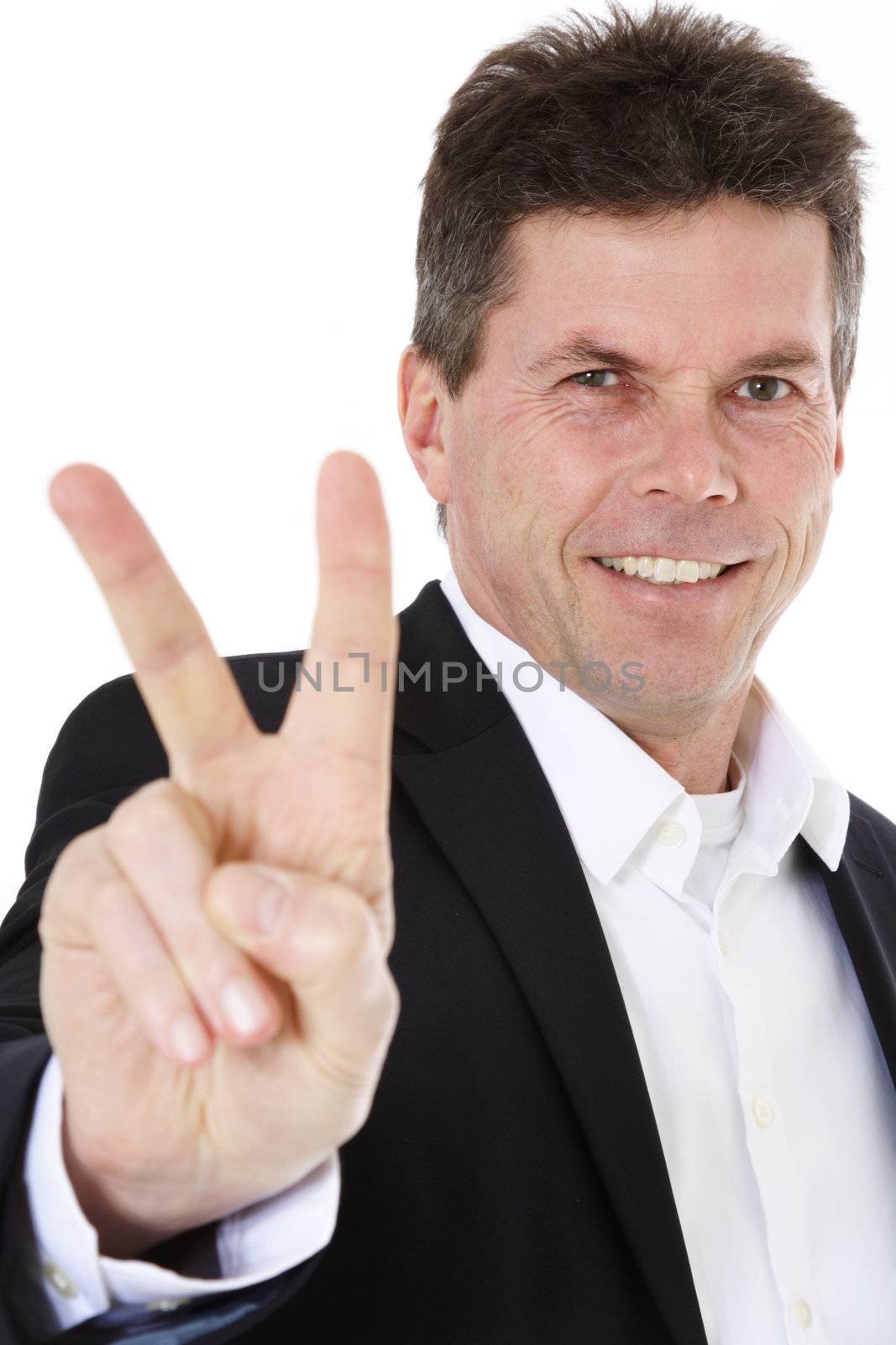 Attractive middle-aged man making victory sign. All on white background.