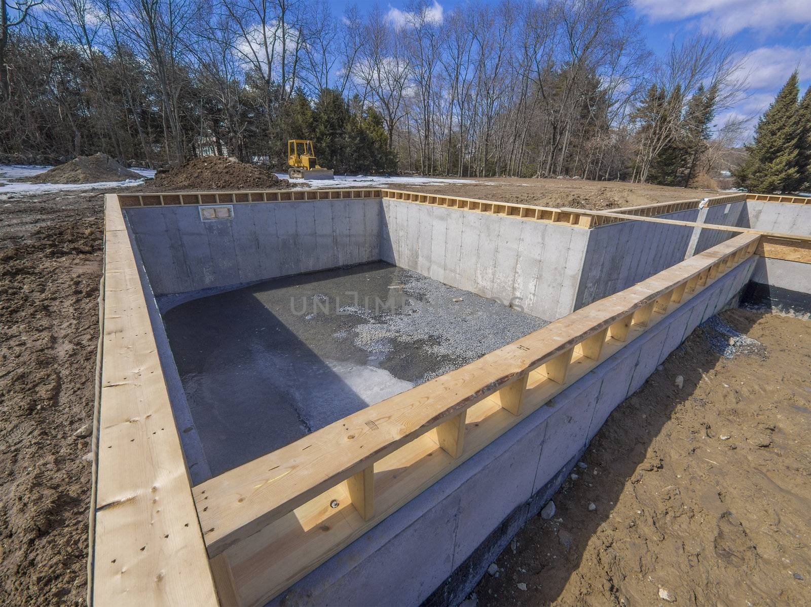 Poured concrete basement and house foundation