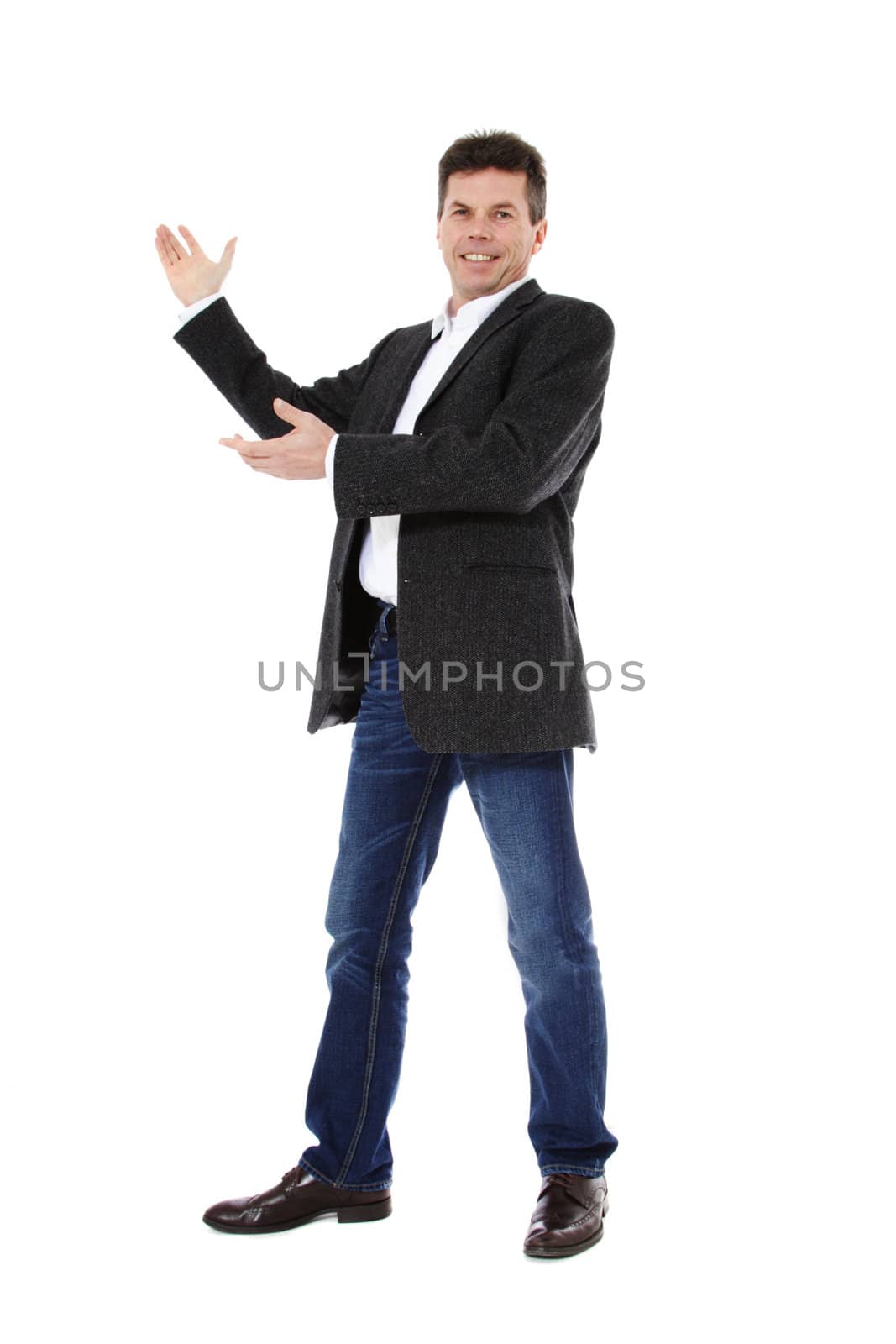 Attractive middle-aged man pointing to the side. All on white background.