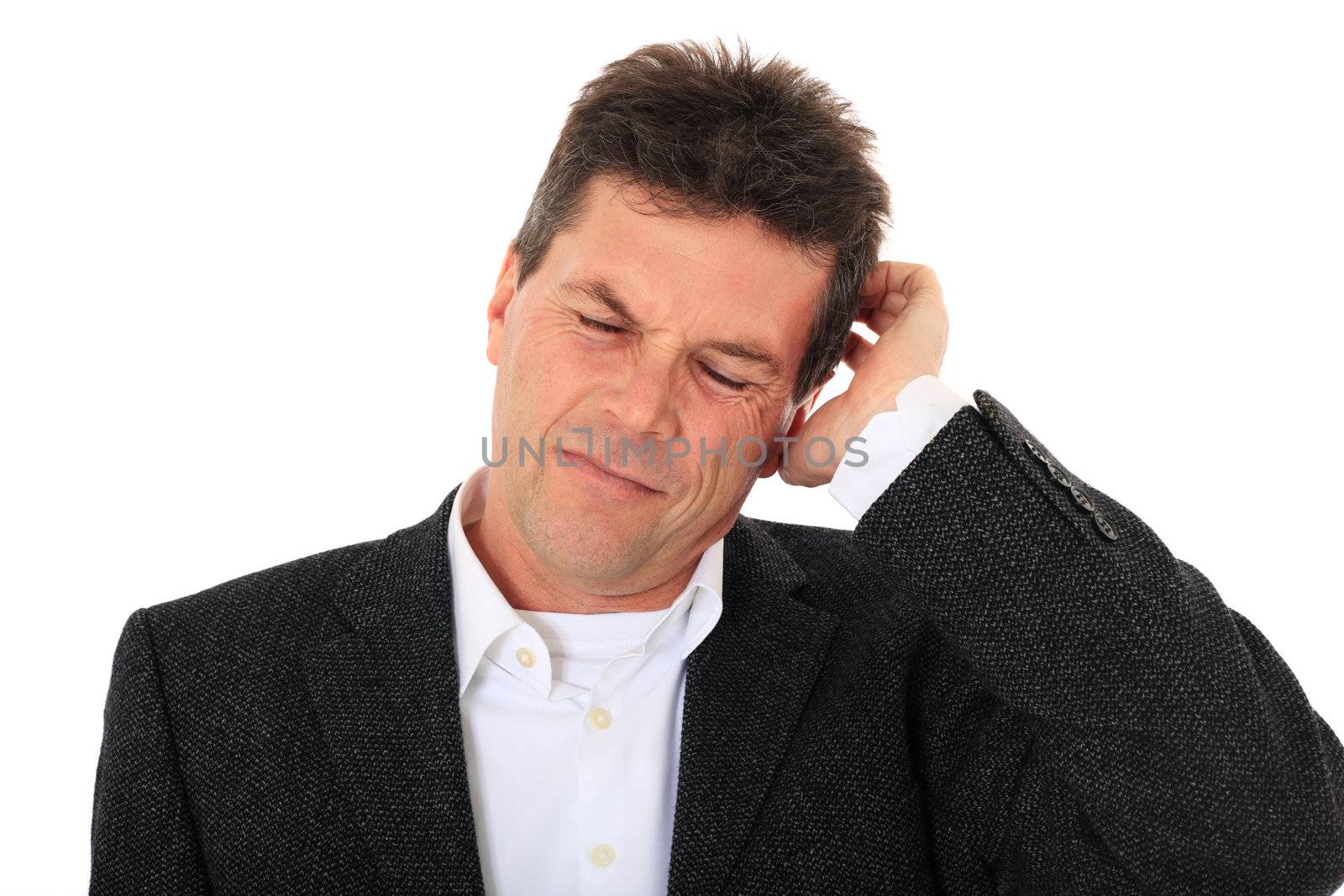 Attractive middle-aged man deliberates a decision. All on white background.