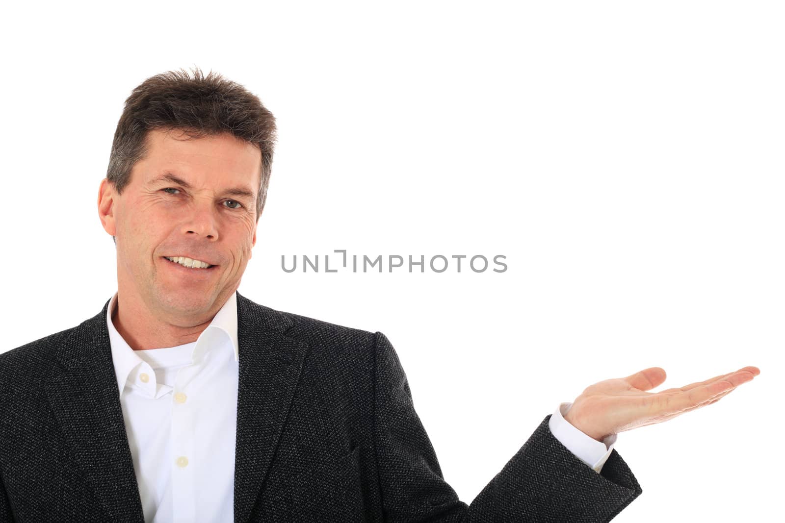 Attractive middle-aged man pointing to the side. All on white background.