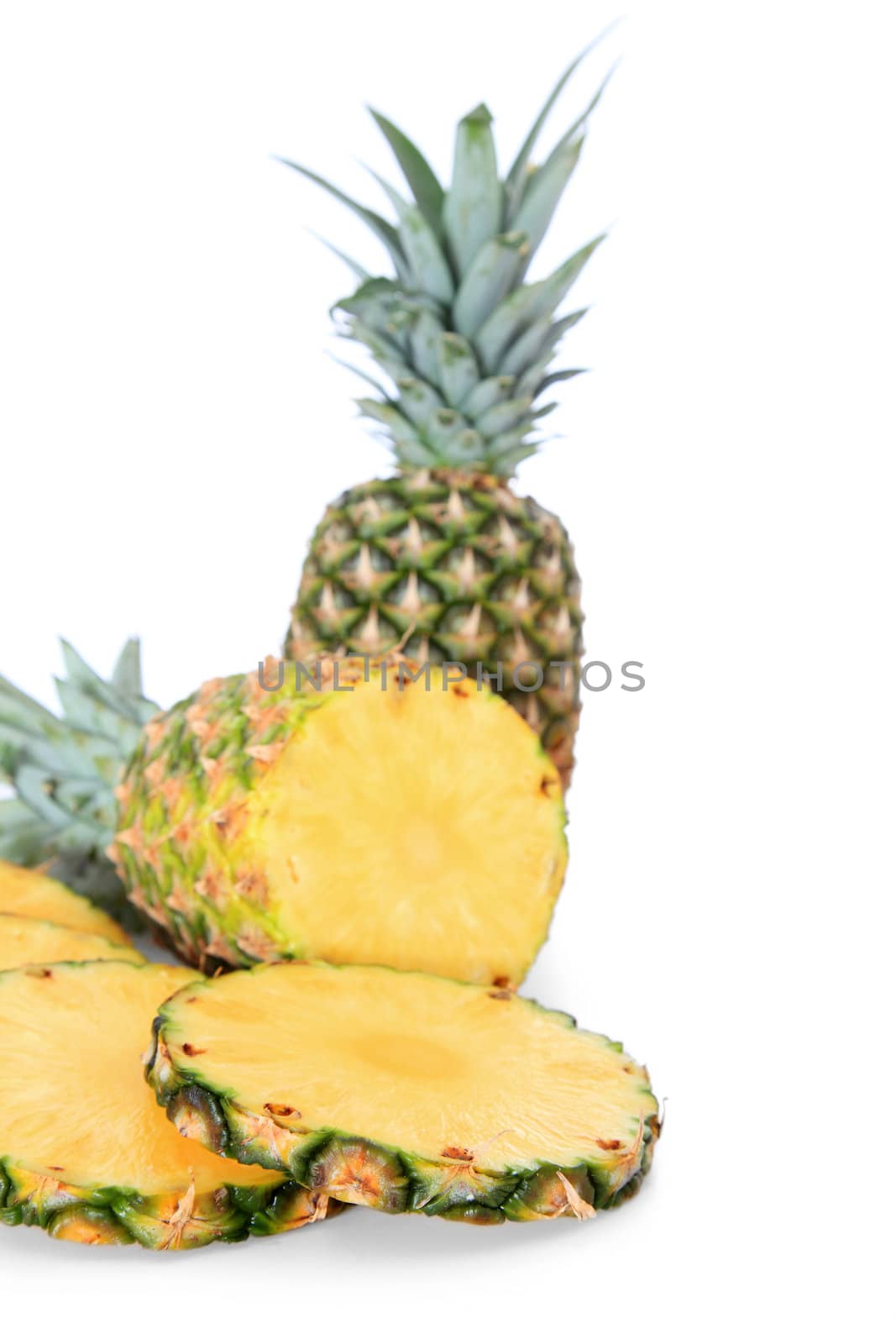 Sliced pineapples on white background.