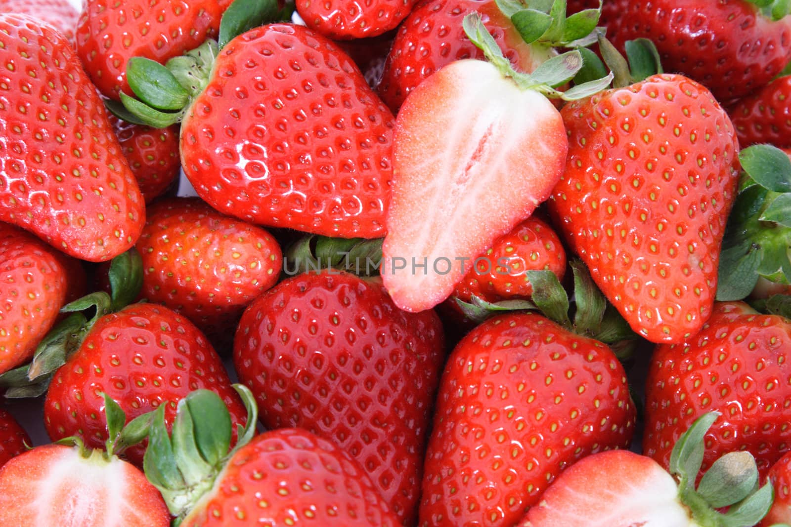 Ripe strawberries background texture.