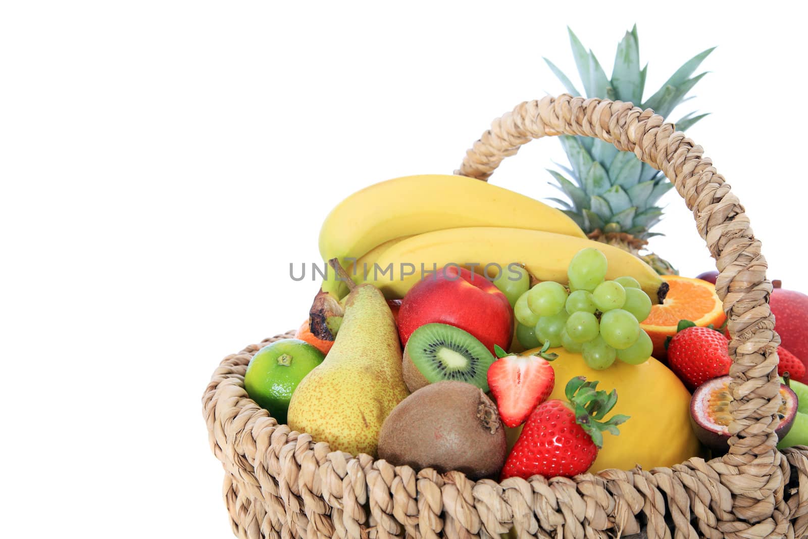 Basket full of various ripe fruits.