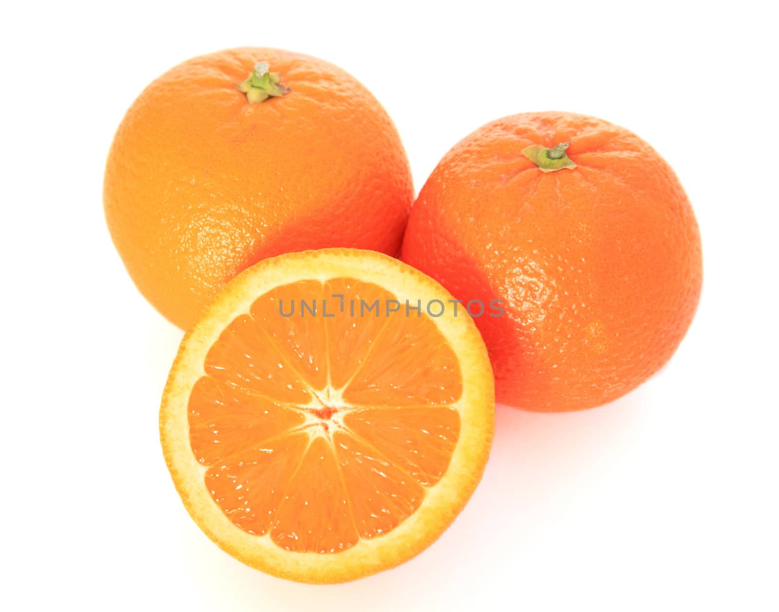 Ripe oranges on white background.