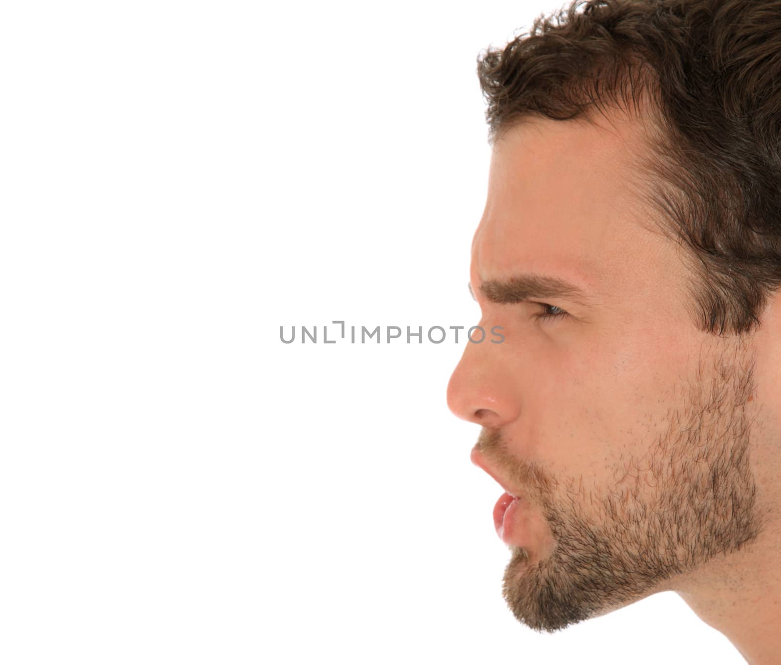 Portrait of an angry man. All on white background. Extra copy space on left side.