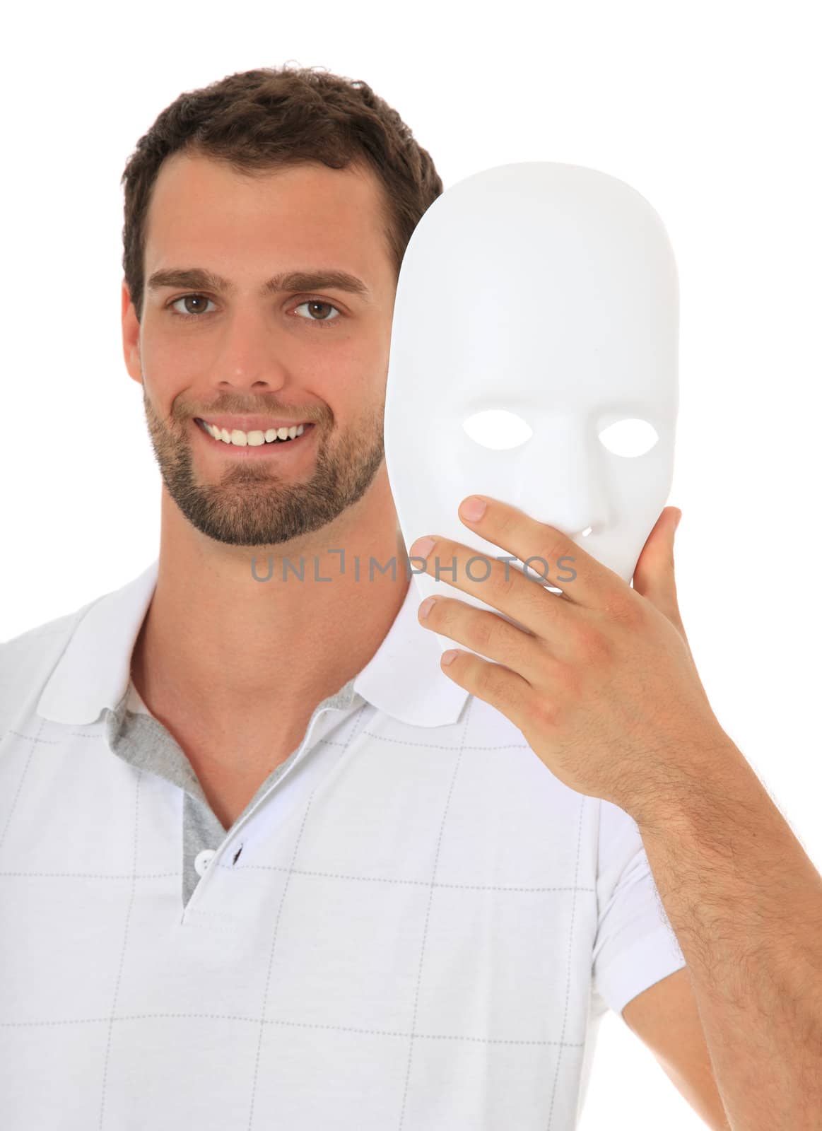 Young guy takes off white mask. All on white background.